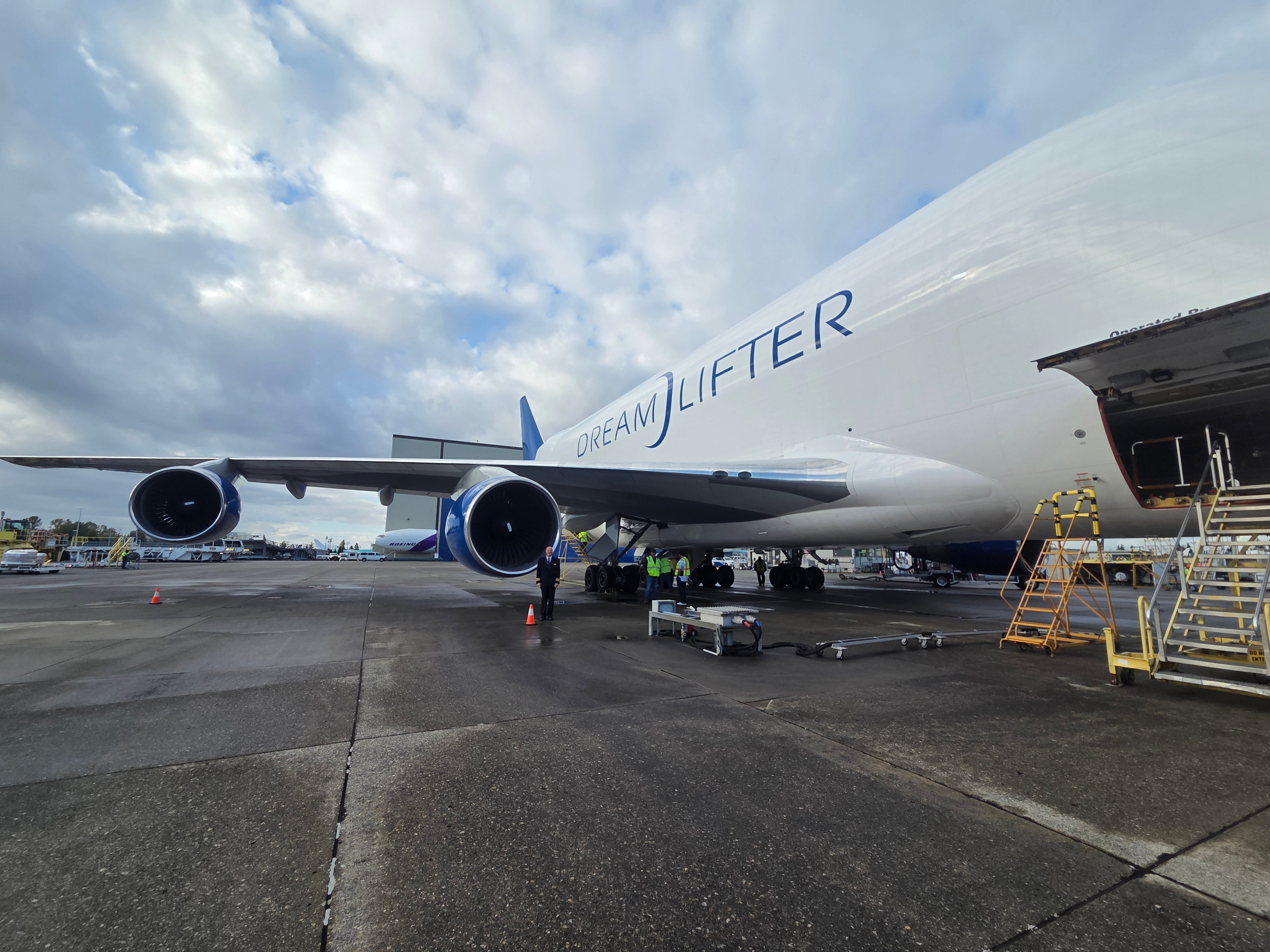 Capt. Wayne Hoefler (seen standing by the engine) flies cargo planes for Atlas Air. He is suing over severe hearing loss and ongoing tinnitus after going partially deaf on an American Airlines flight last year