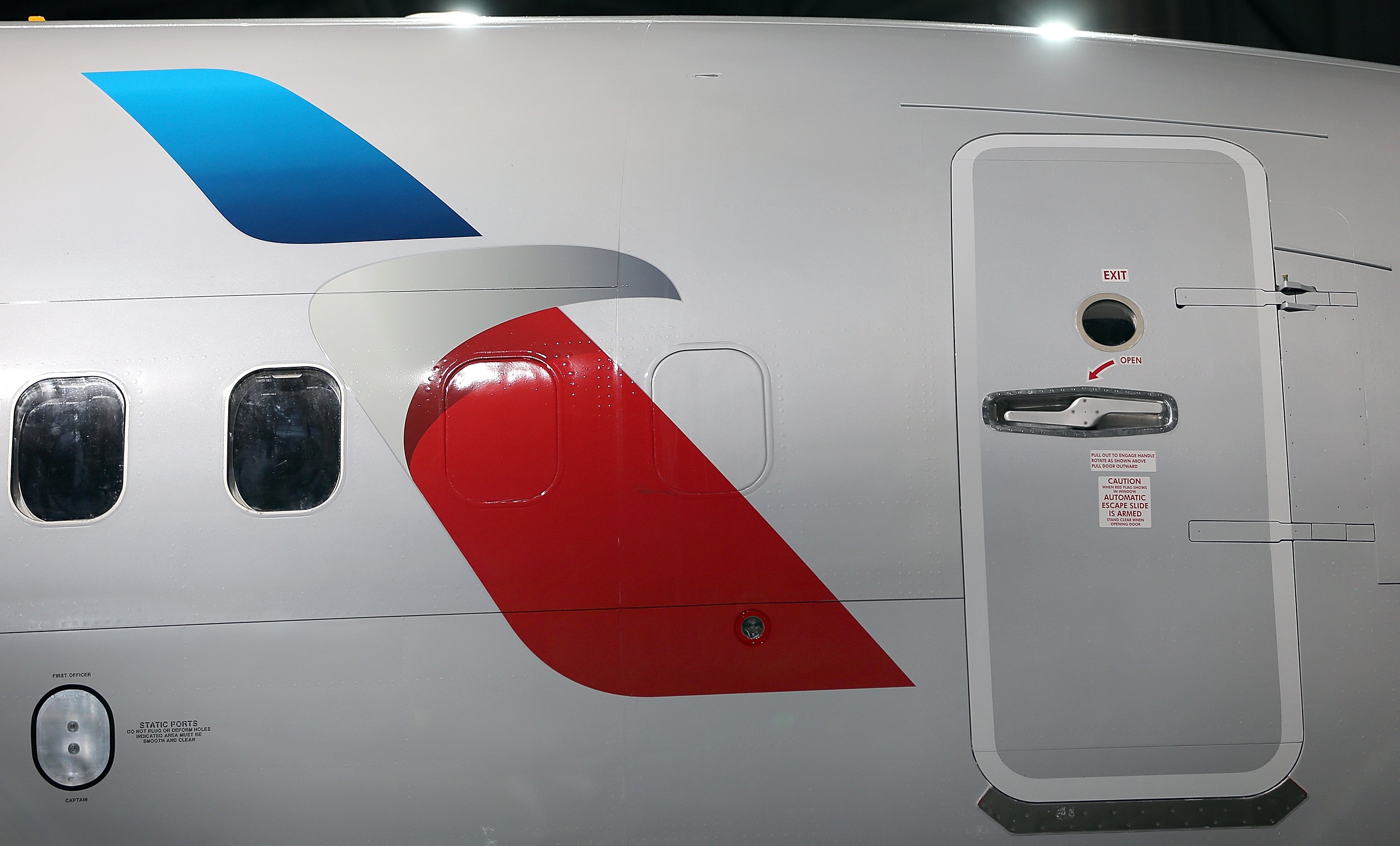 A failed door seal aboard an American Airlines flight last year is responsible for Capt. Wayne Hoefler's hearing loss, according to a federal lawsuit