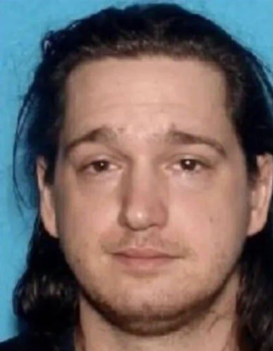 Douglas Irwin Shaw, 41, was booked in jail for Lewis' murder, police say
