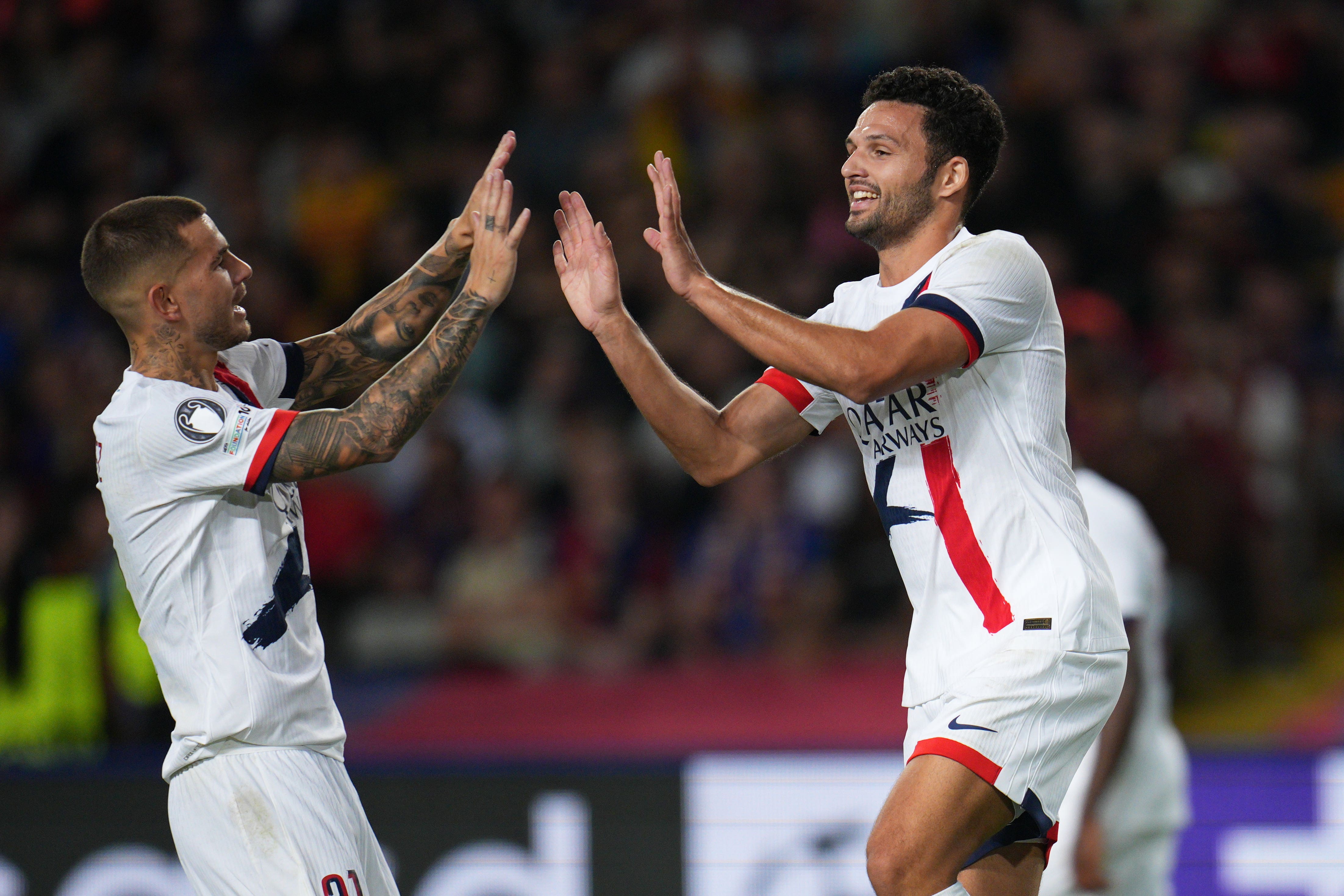 Match winner Goncalo Ramos (right) and Lucas Hernandez celebrate the 2-1 Champions League victory at Barcelona (Emilio Morenatti/AP))