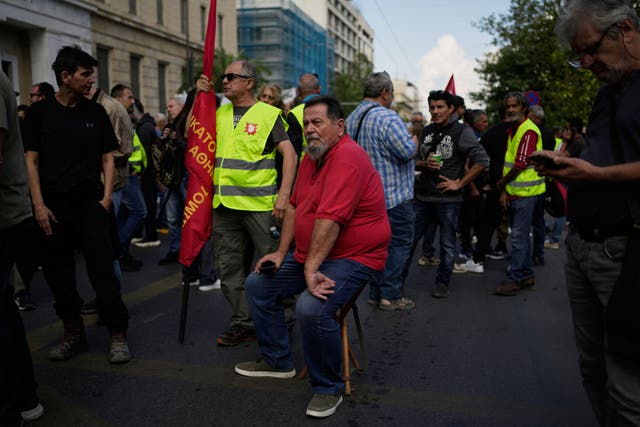 <p>Protesters gather during a nationwide 24-hour strike in Athens, Greece, Wednesday, Oct. 1, 2025, as labor unions demand higher wages and the withdrawal of a bill changing work hours</p>
