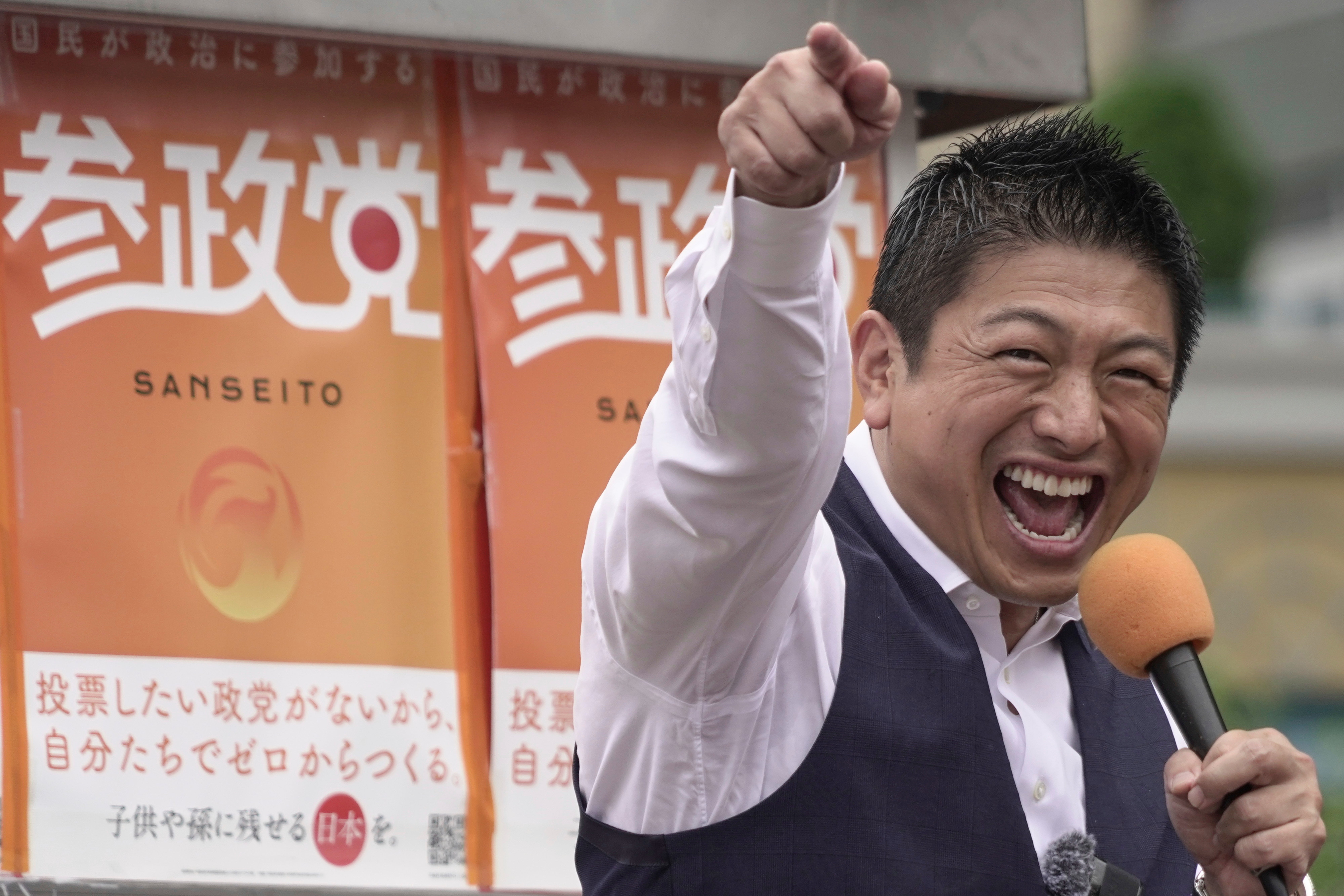 Japan's Sanseito leader Sohei Kamiya speaks at election campaign in Yokohama, near Tokyo Japan, Monday, Sept. 15, 2025. (AP Photo /Mayuko Ono)