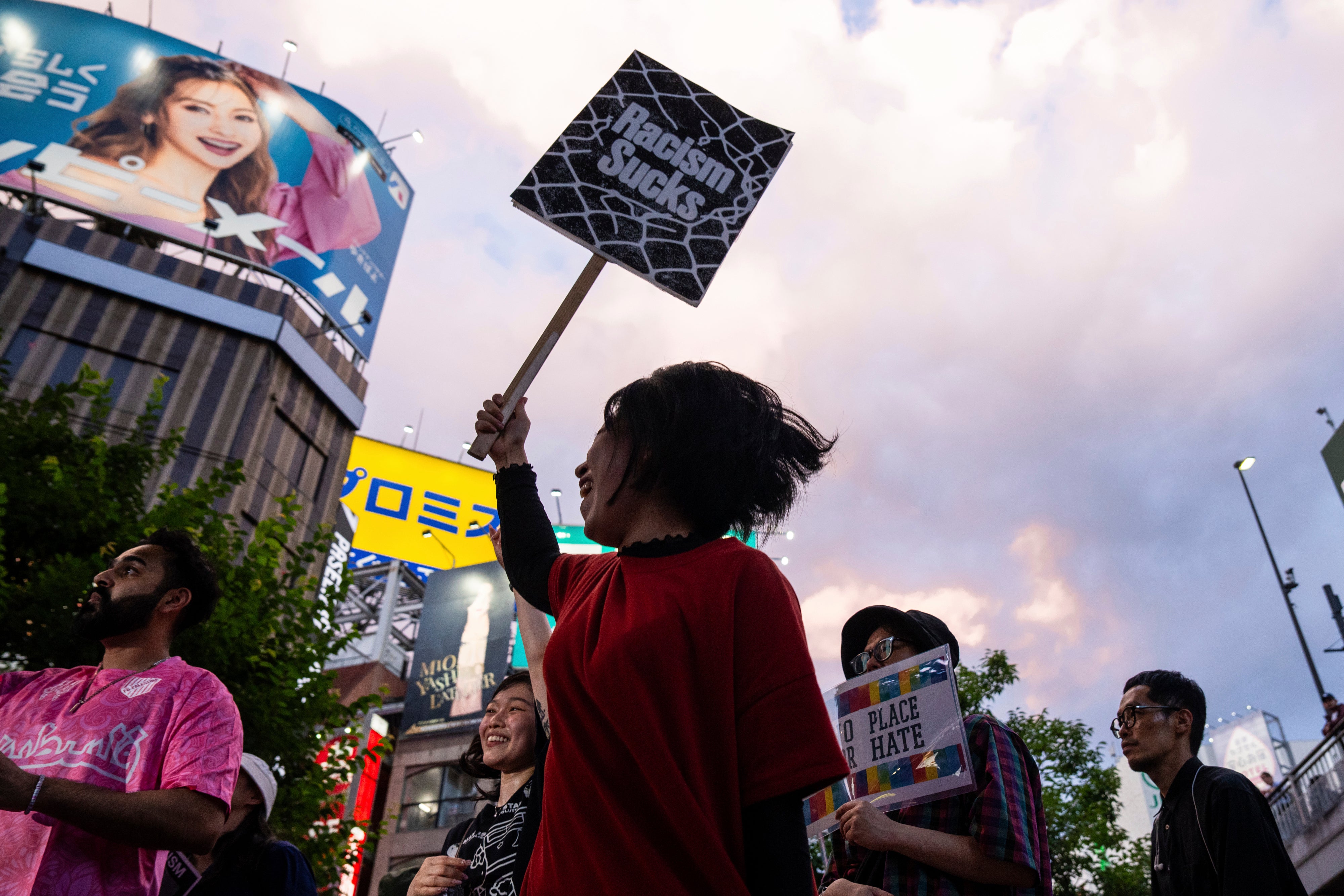 Demonstrators take part in a 'protest rave' against racism and nationalist party Sanseito ahead of the upper house election in the Shinkuku district of Tokyo, on July 13, 2025. (AP Photo/Louise Delmotte, File)