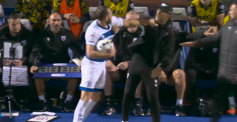 QPR defender Rhys Norrington-Davies and Oxford boss Gary Rowett get physical on the touchline