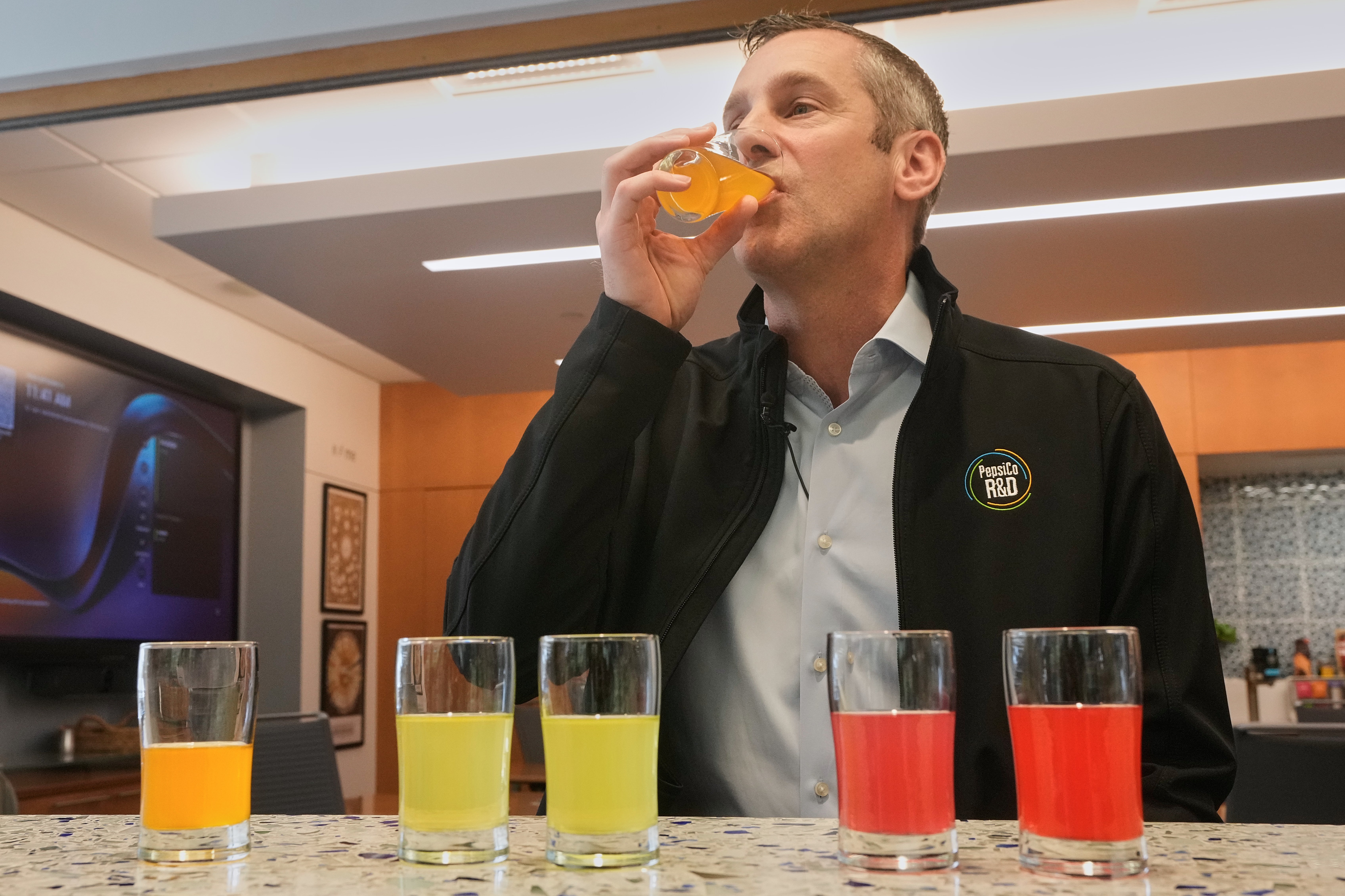 Damien Browne, vice president of research and development for PepsiCo's beverages, tastes a beverage at the company's R&D Campus, in Valhalla, NY, Friday, Sept. 19, 2025. (AP Photo/Richard Drew)