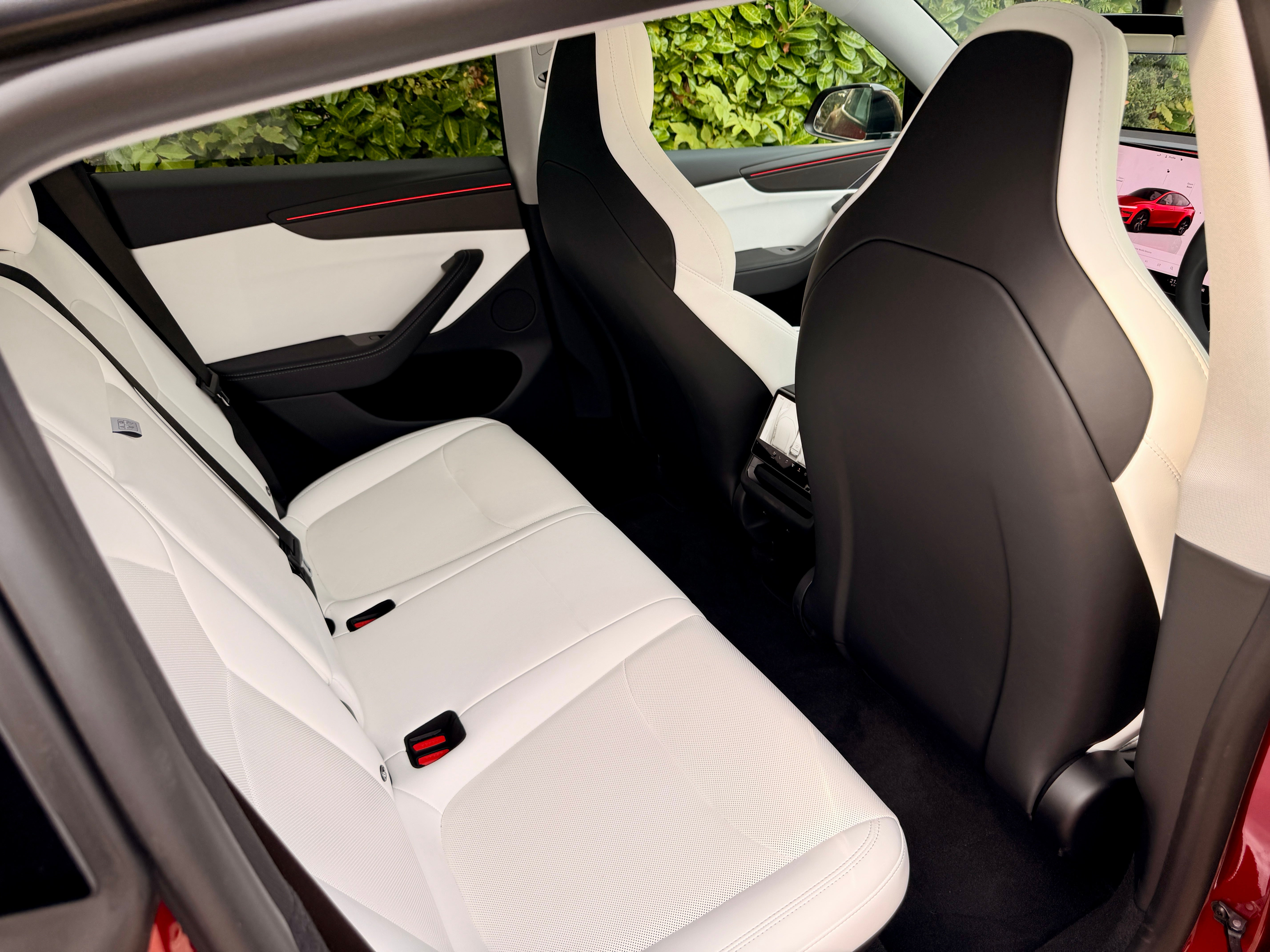 Rear seat passengers in the Tesla Model Y Performance get an 8in screen to play games on