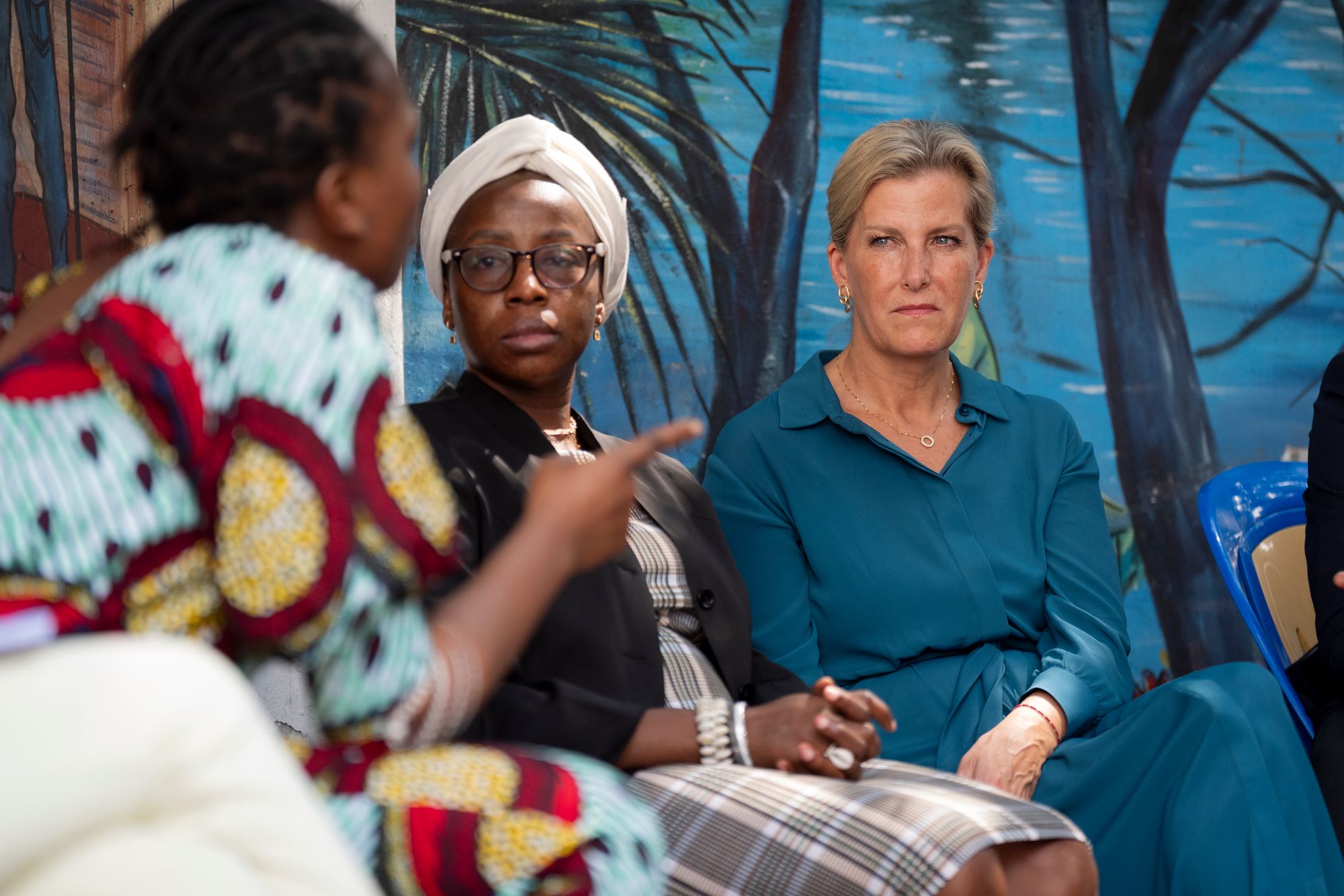 Sophie talks with people at the Makala Prison Safe House