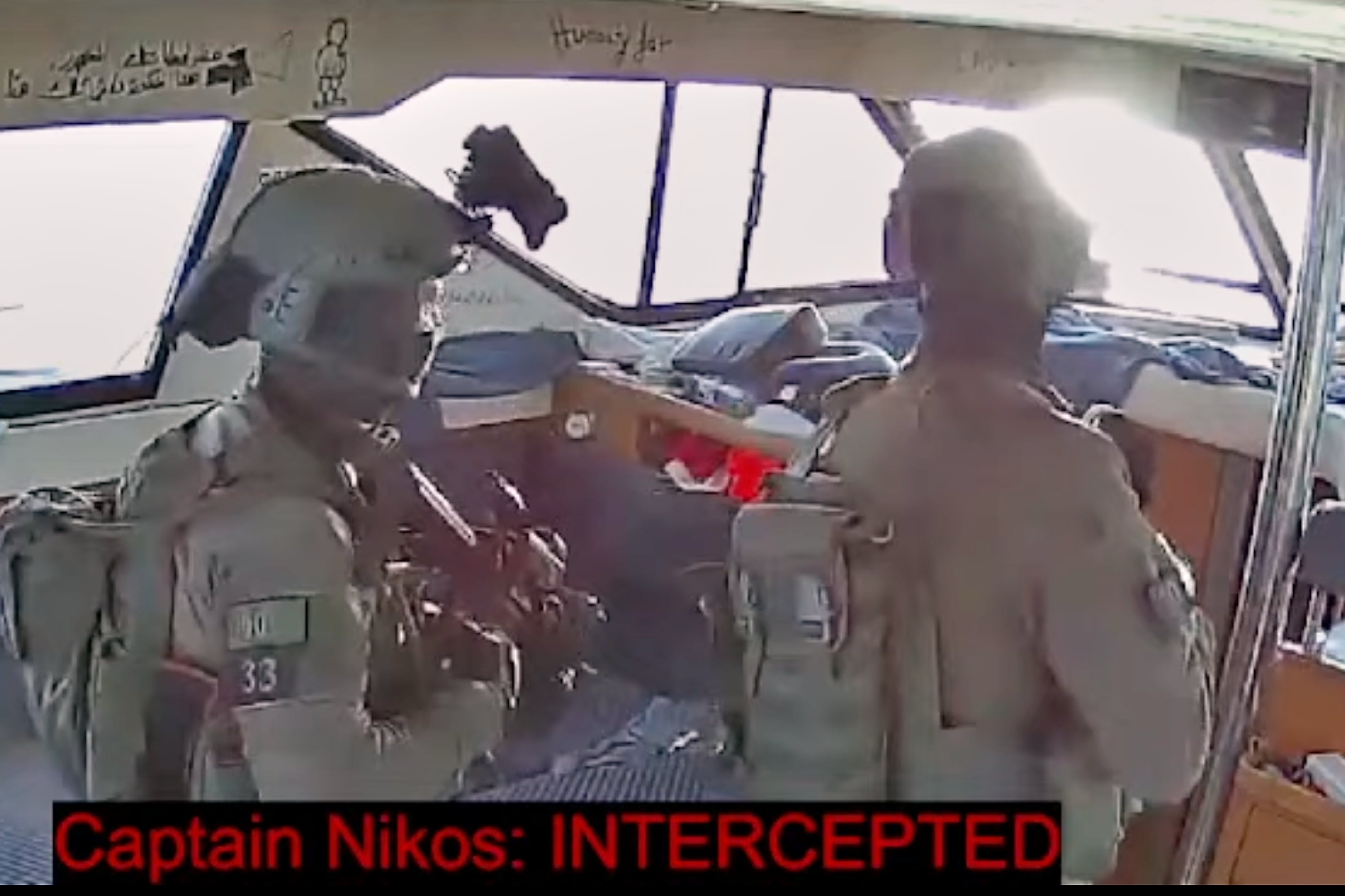 This grab from a video released by the Global Sumud Flotilla shows Israeli navy soldiers aboard one of the flotilla's vessels after it was intercepted