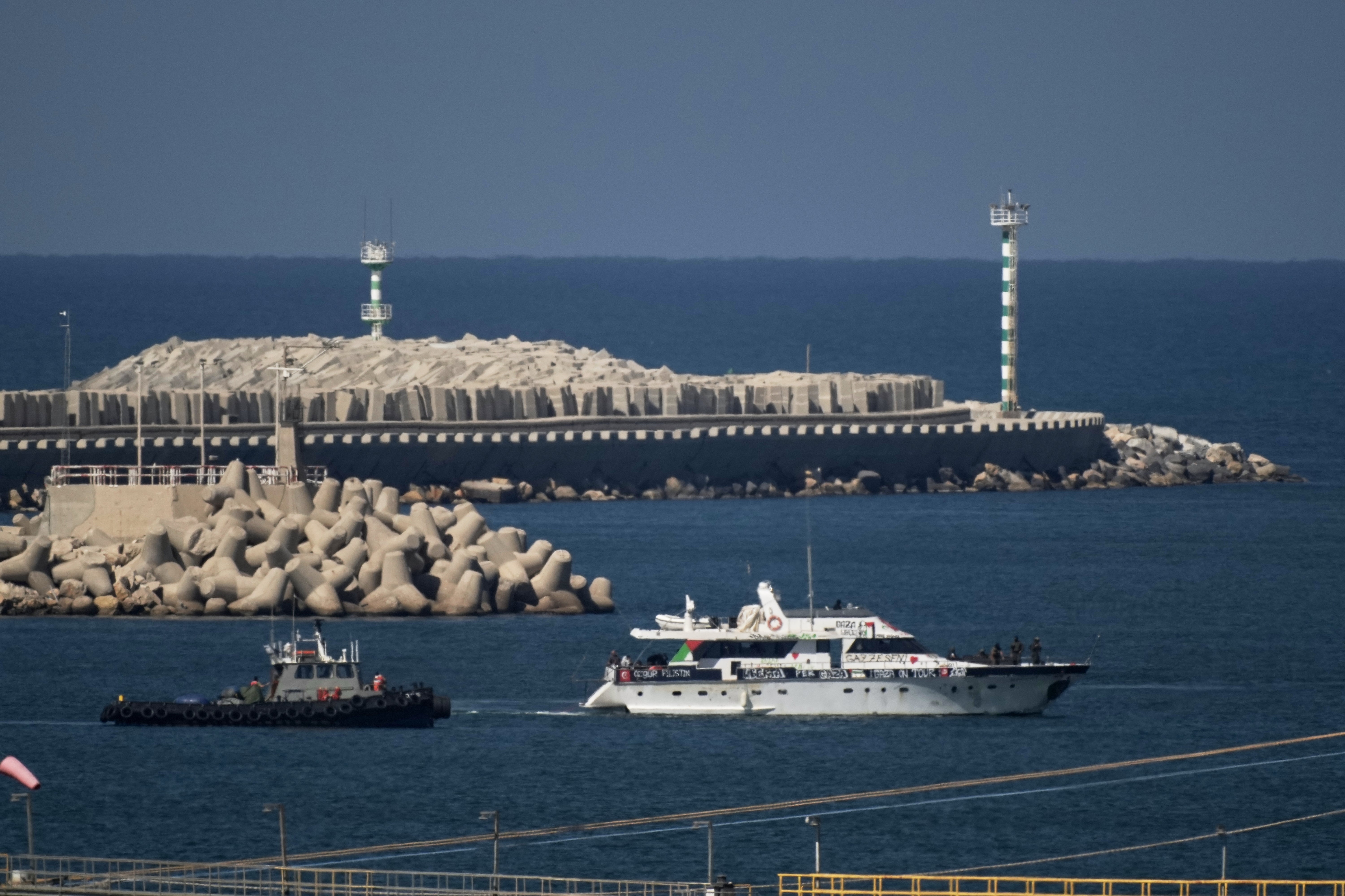 A Gaza-bound flotilla boat is escorted into the port of Ashdod, Israel