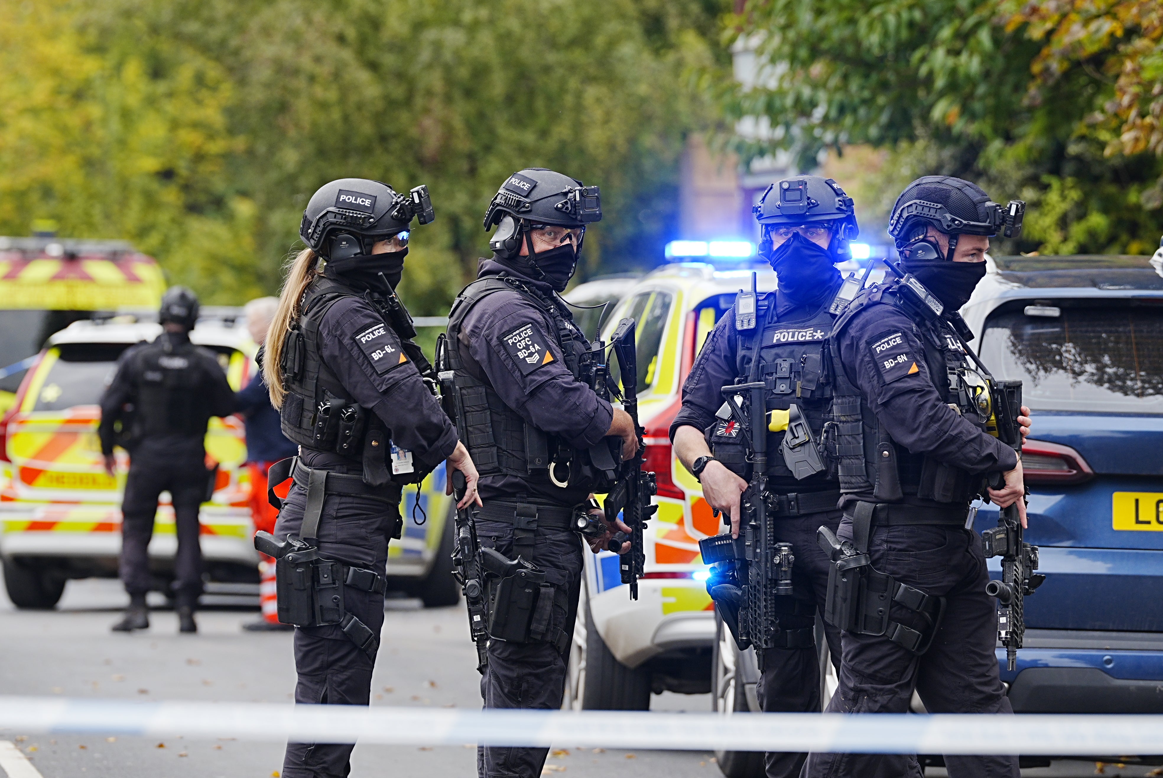 Officers gather near the Heaton Park Hebrew Congregation synagogue after two people were killed and four were injured in a terror attack