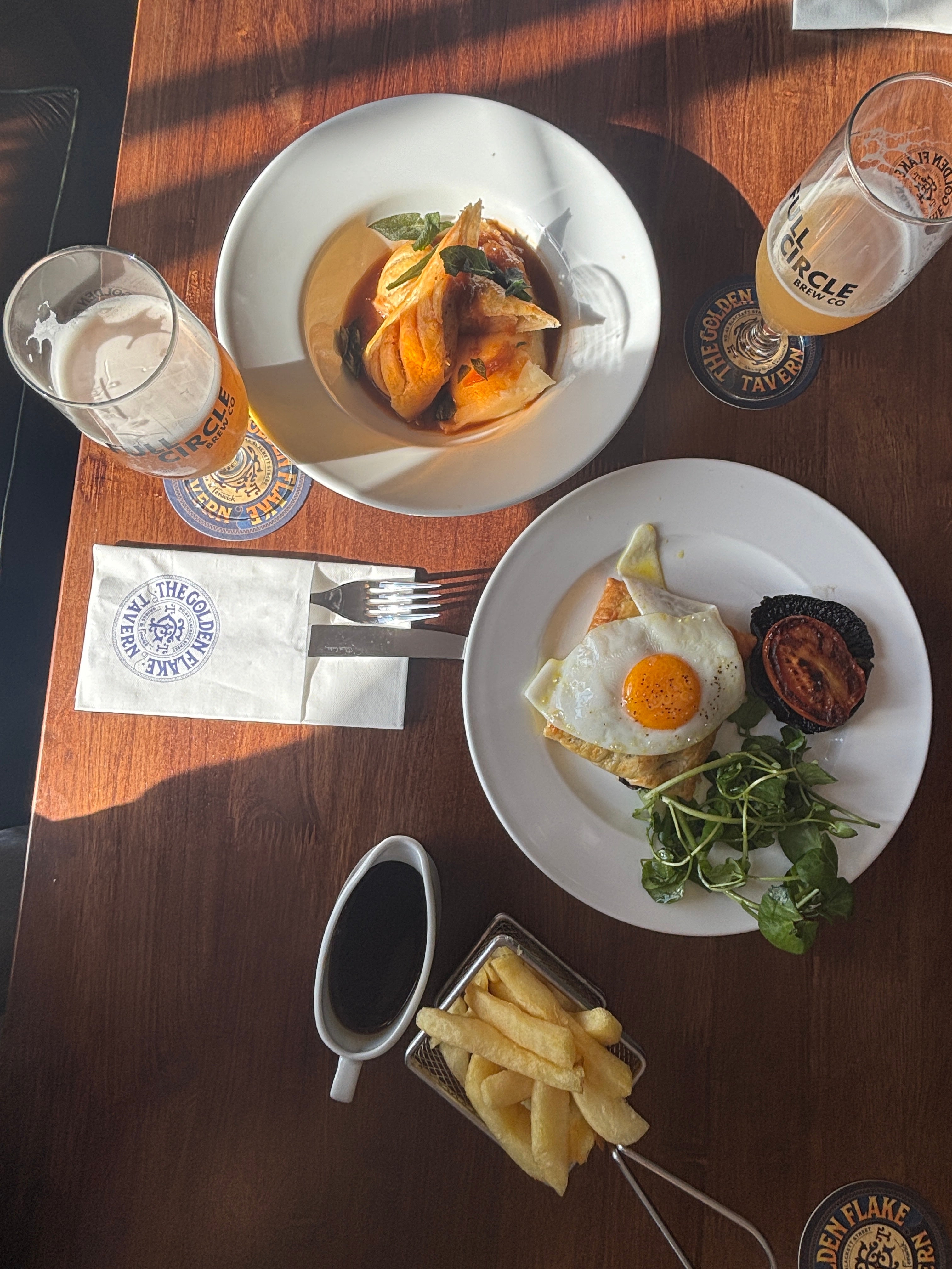 The sausage roll and mash, next to a steak bake grill