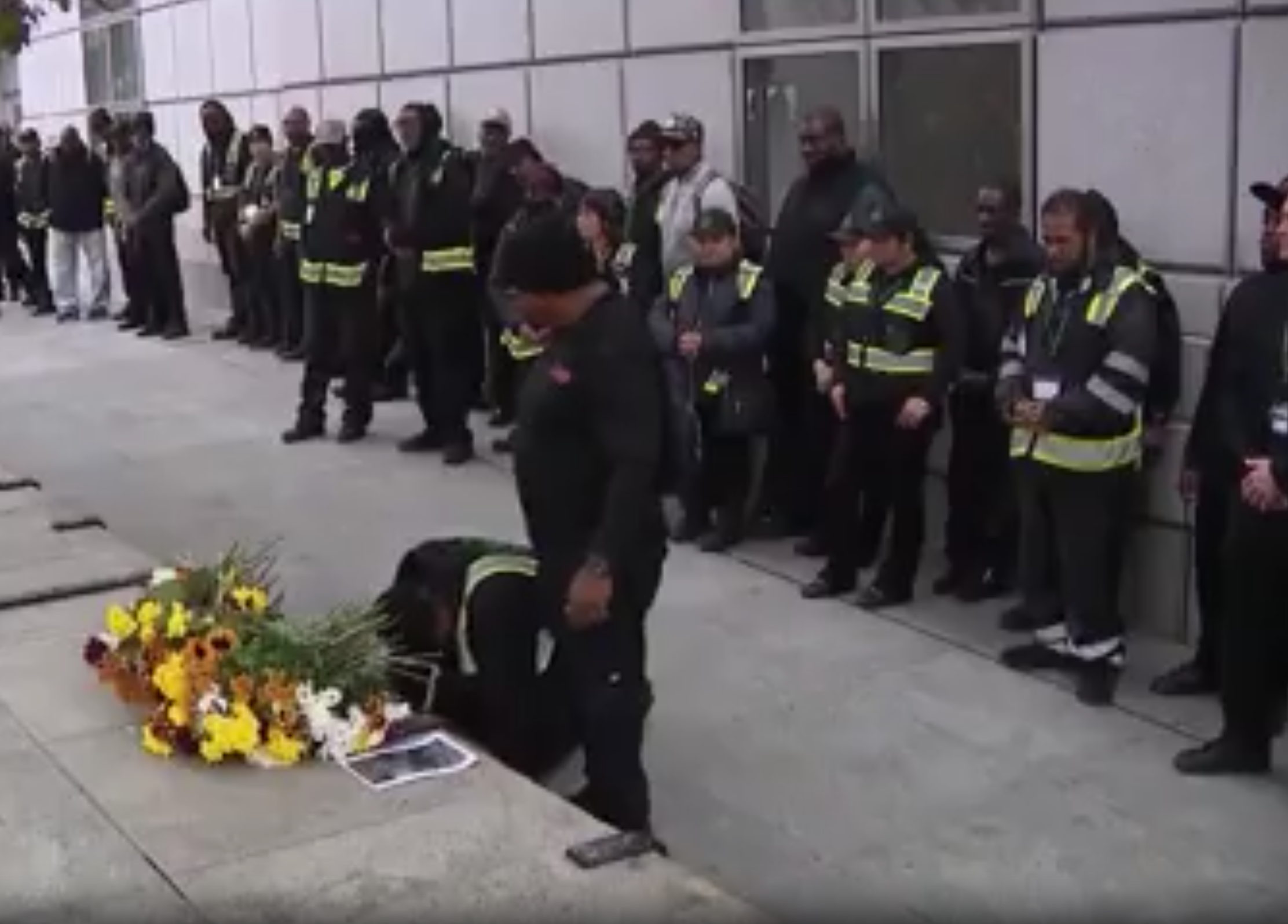 Mourners gather outside the San Francisco Main Library to remember Joey Alexander, 60, who was shot and later died after he asked a man to stop using drugs outside the building