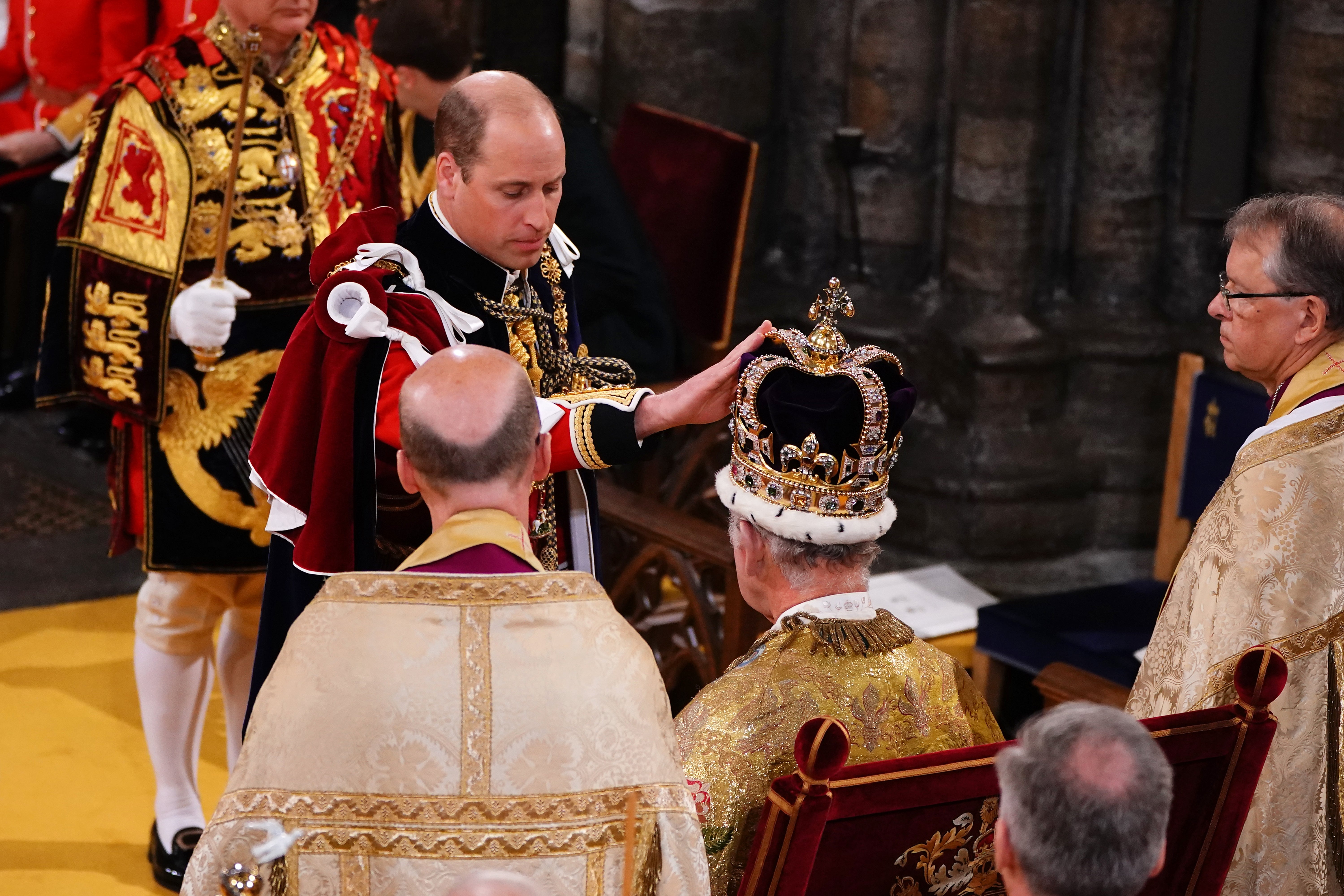 William with his father Charles during the King’s coronation at Westminster Abbey