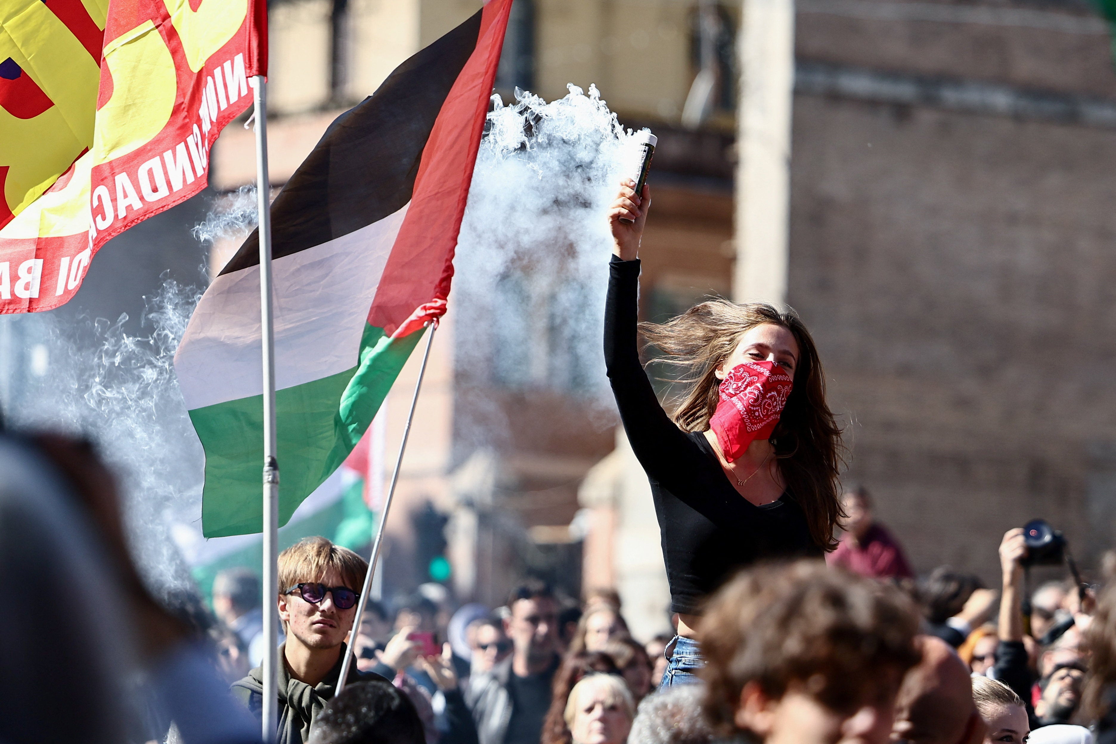 Pro-Palestinian demonstrators protest during a nationwide strike called by the USB union to condemn the Israeli forces' interception of the Global Sumud Flotilla vessels aiming to reach Gaza and break Israel's naval blockade, in Rome, Italy
