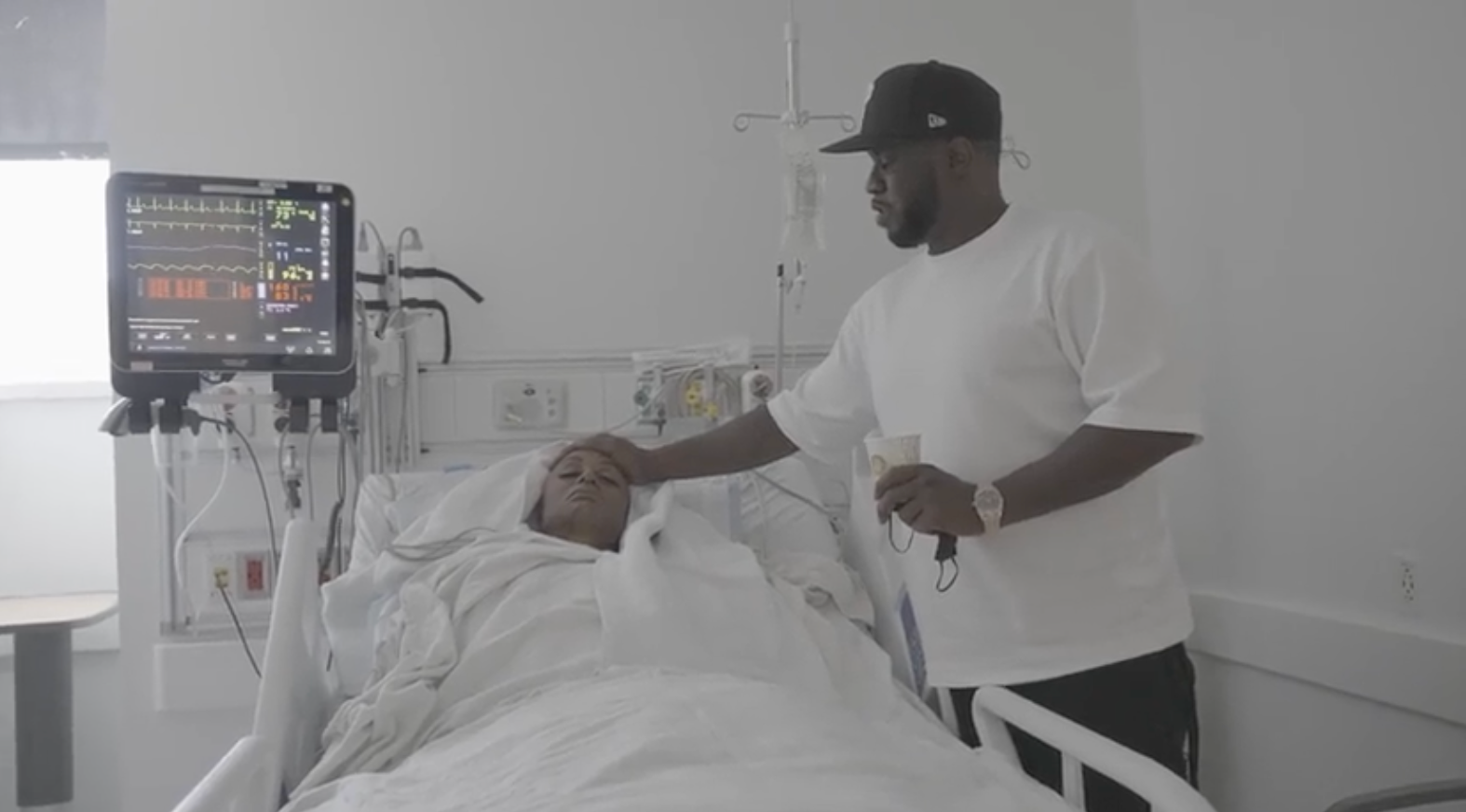 In one clip, Combs is seen caring for his late partner Kim Porter in the hospital before her death in 2018