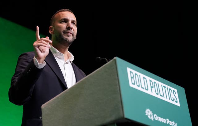 <p>Green Party leader Zack Polanski speaking during his party’s conference at Bournemouth International Centre on Friday</p>