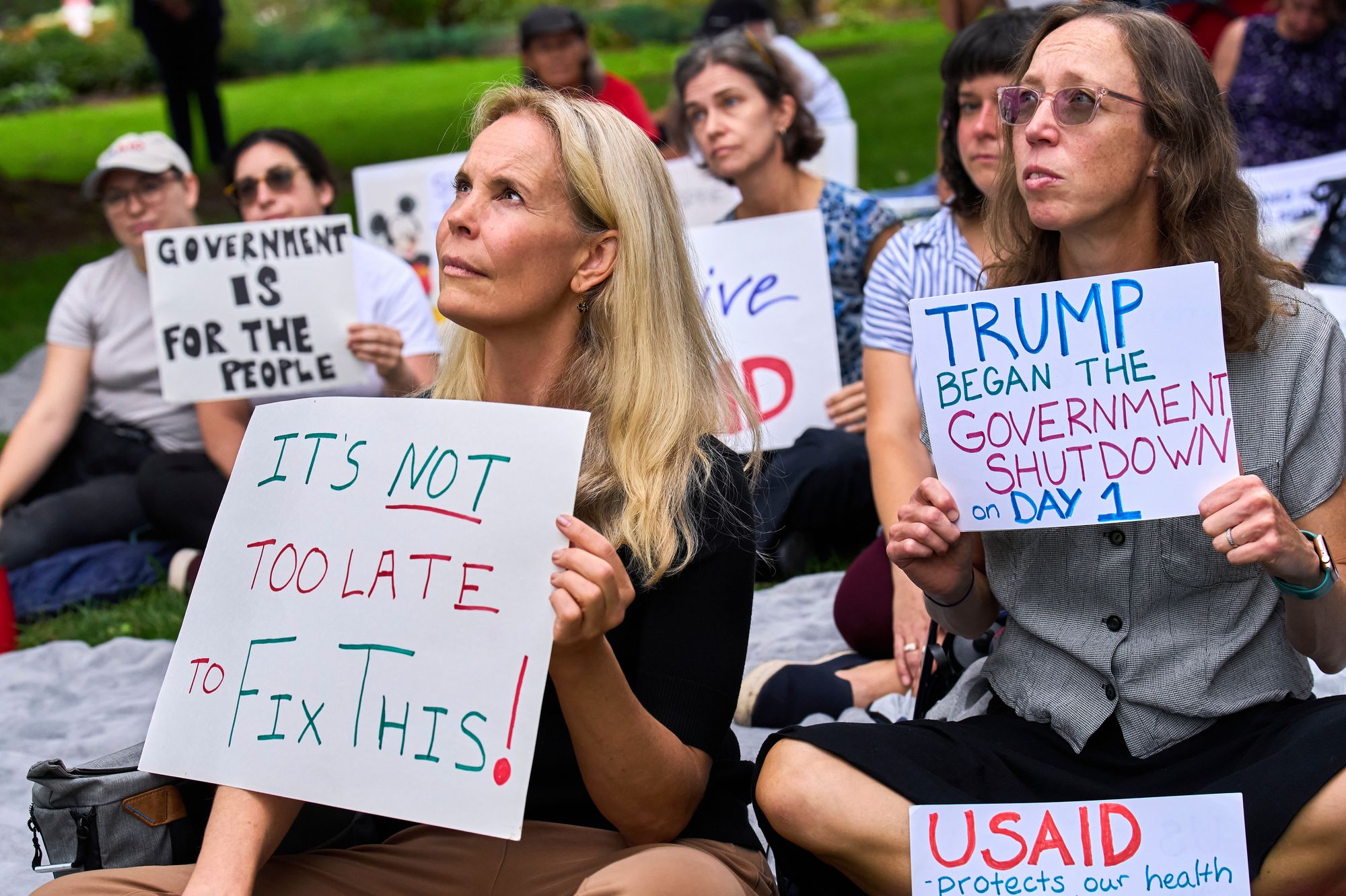 Federal workers protest a government shutdown as members of Congress scramble to put together a continuing resolution to fund the government