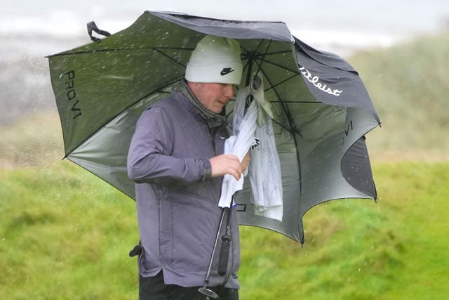 Robert MacIntyre battled tough conditions to share the lead on home soil (Jane Barlow/PA)