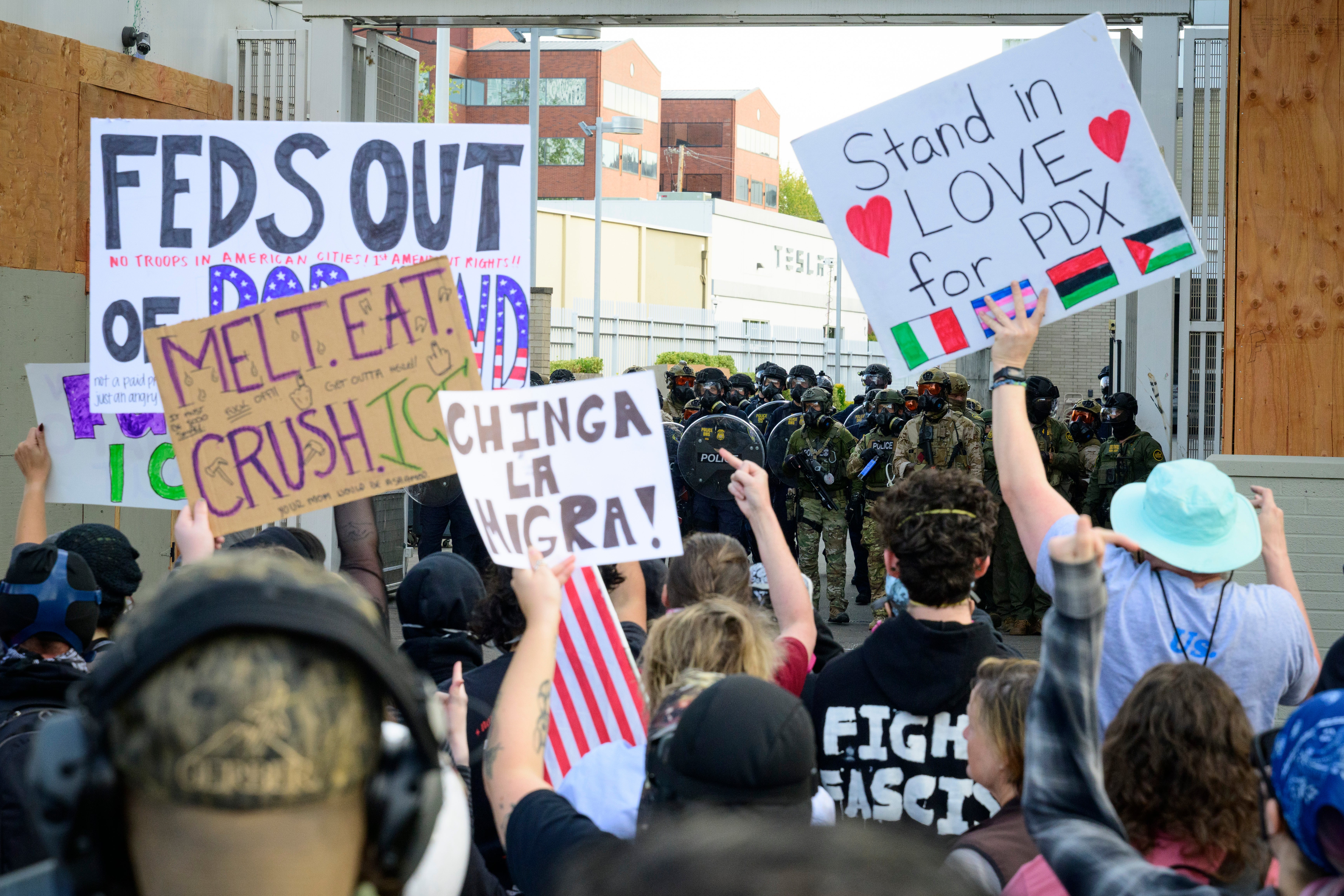 Federal agents confront Antifa protesters outside of the U.S. Immigration and Customs Enforcement building on in Portland, Oregon