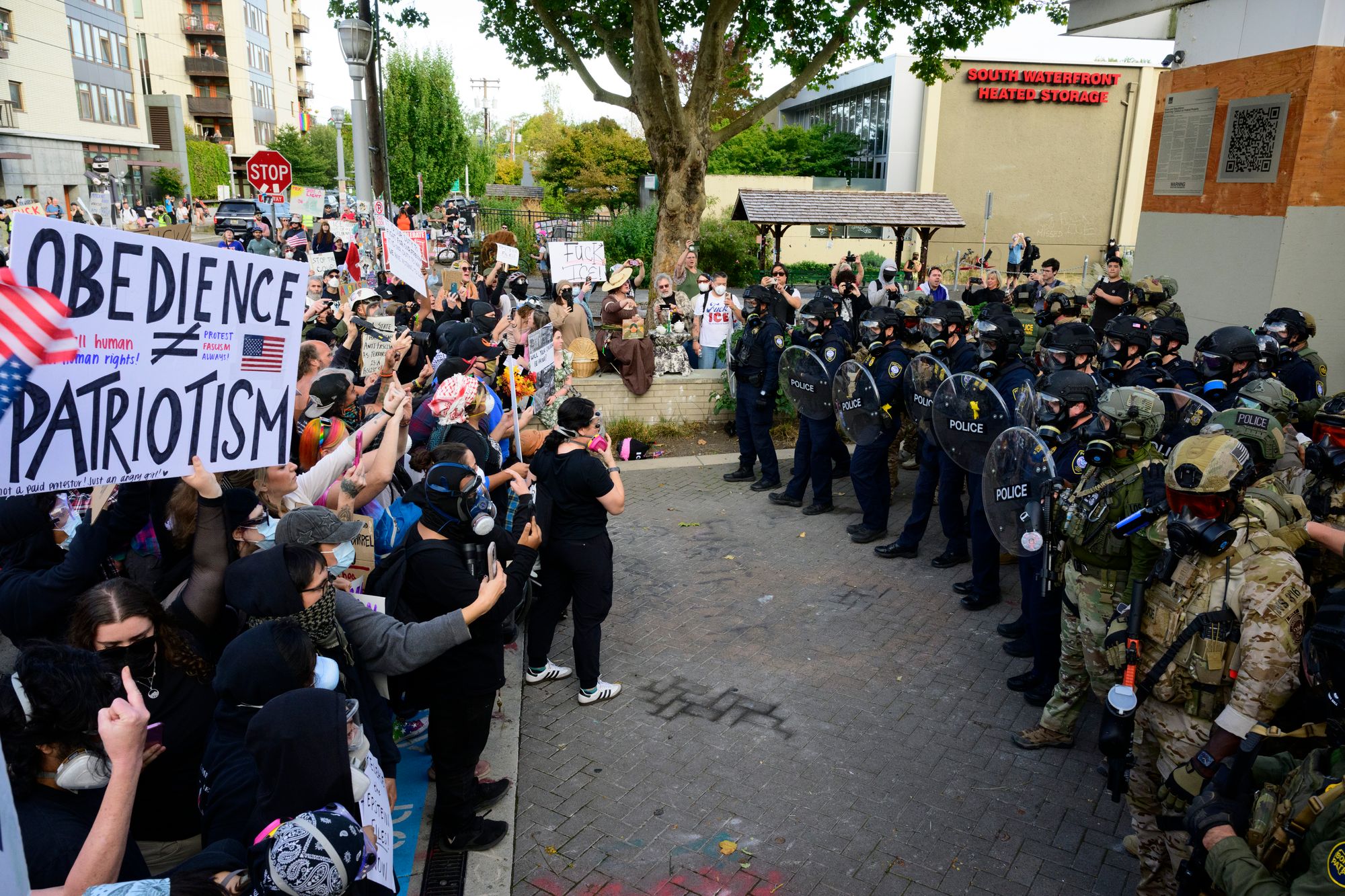 Federal agents confront protesters outside of the U.S. Immigration and Customs Enforcement building on September 28, 2025 in Portland, Oregon. The president had not established that there was a ‘rebellion or danger of rebellion,’ or that he was unable to enforce the law with regular forces, a judge ruled Friday