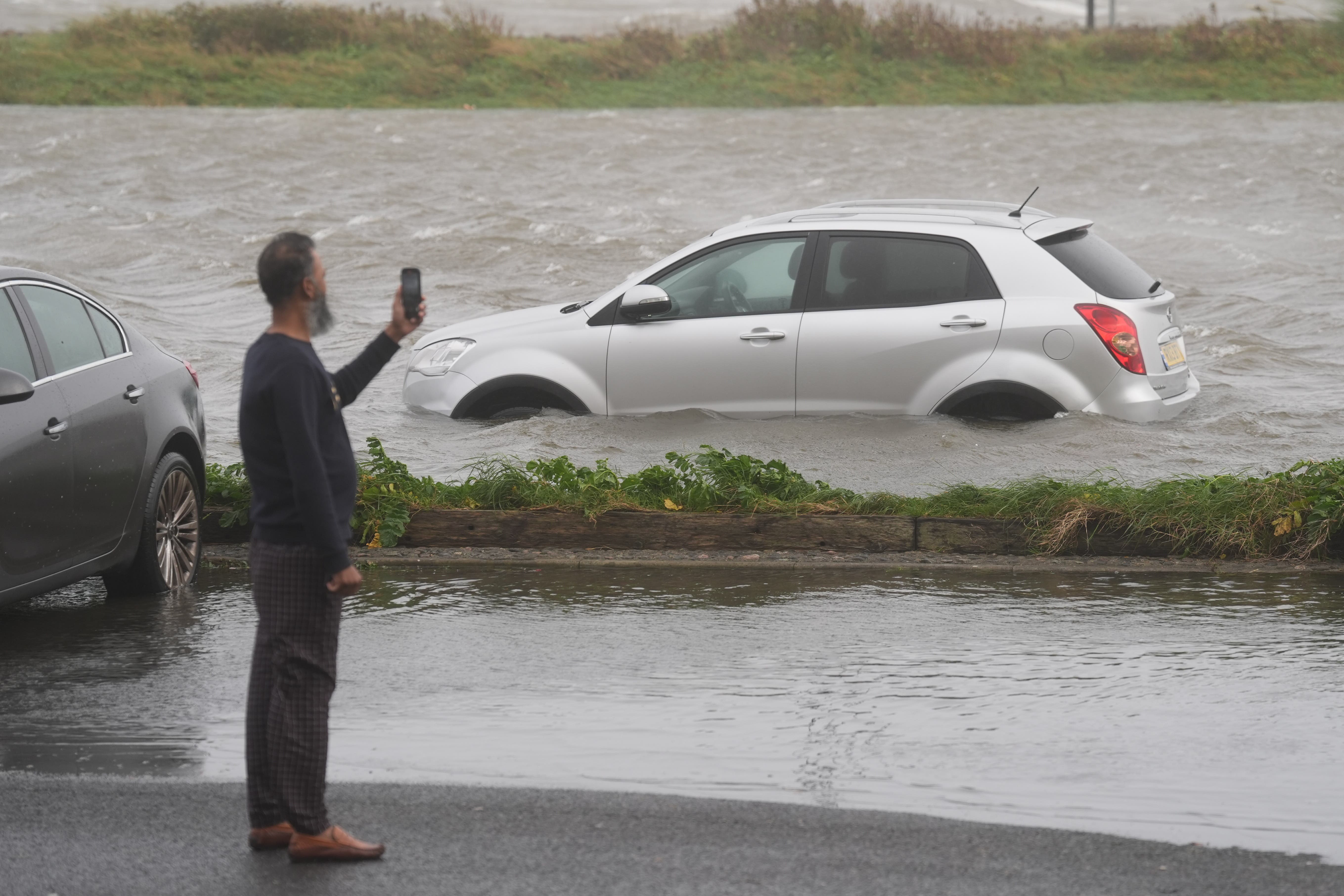 A car in a flooded carpark in Galway during Storm Amy