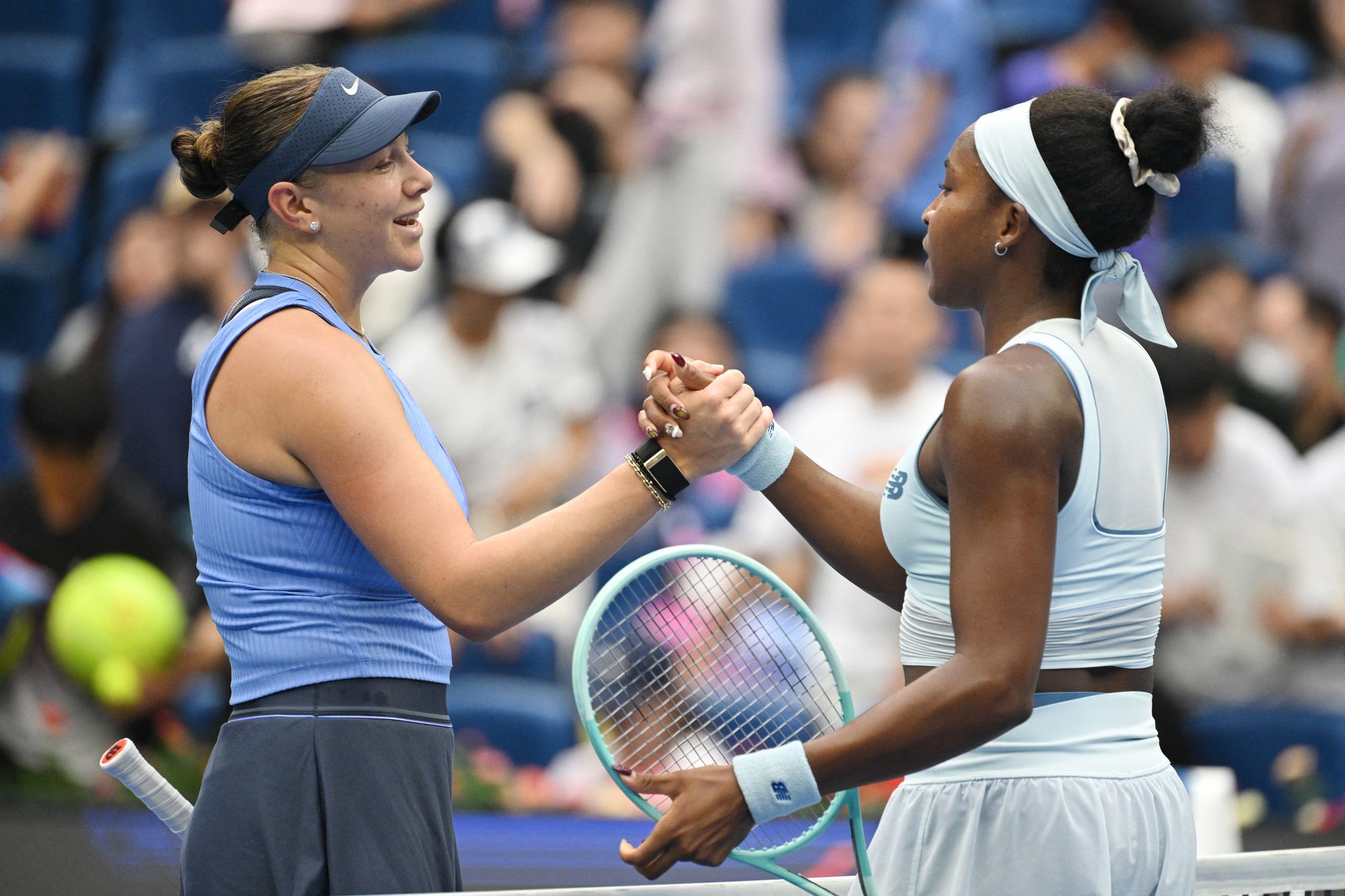 Anisimova and Gauff shake hands after the 6-1 6-2 win