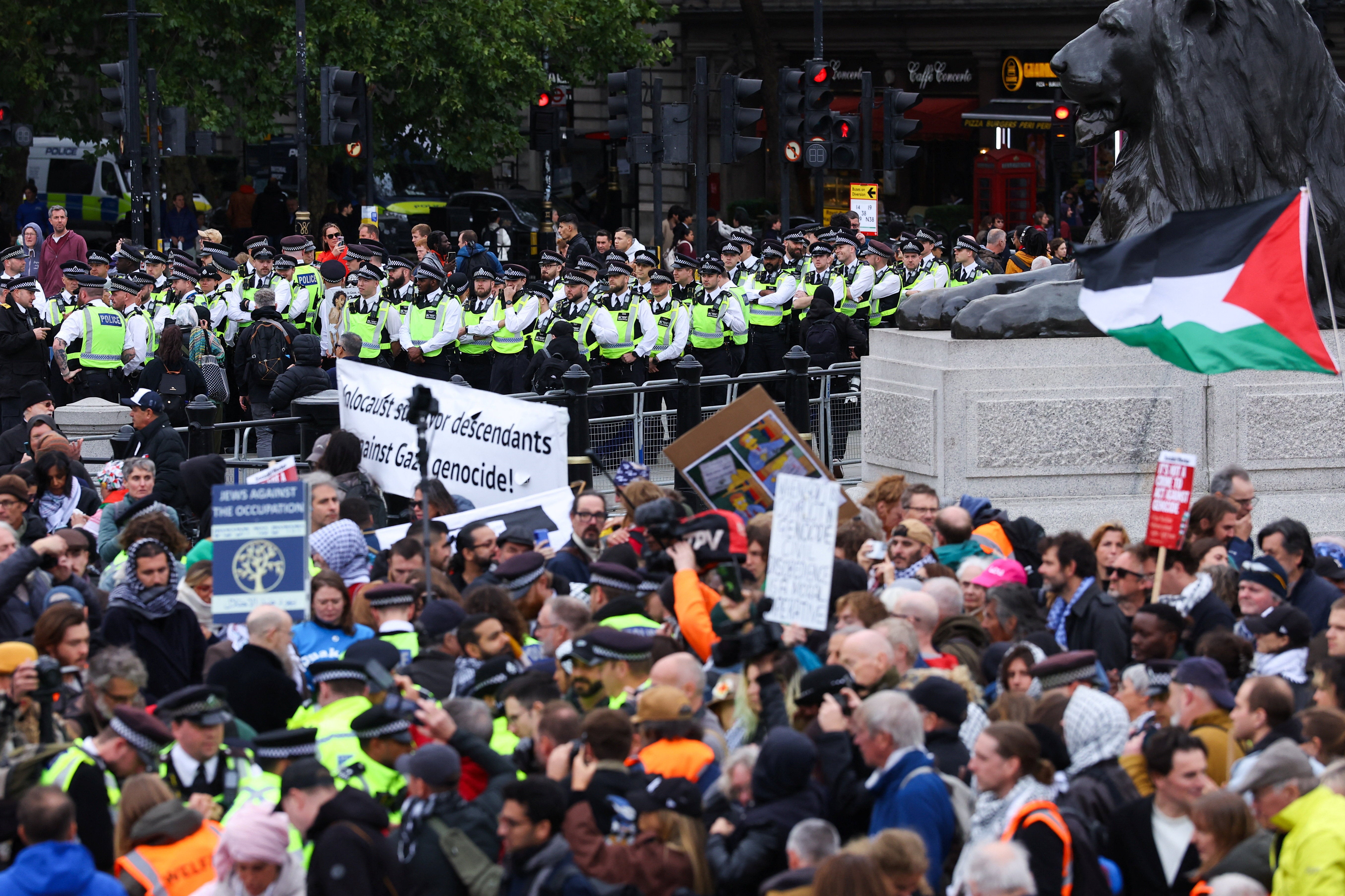 Police officers stand guard during a mass demonstration organised by Defend our Juries