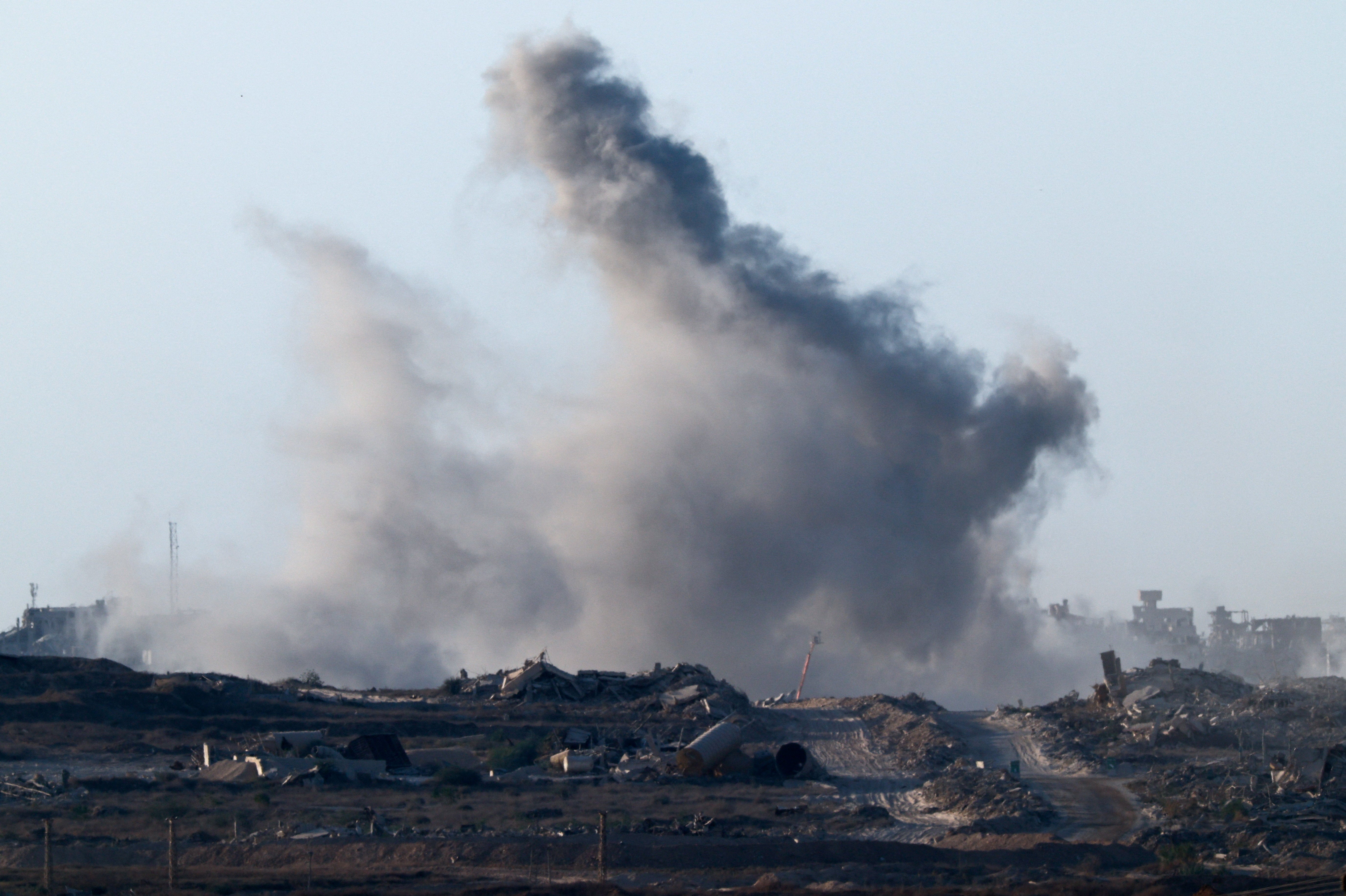 Smoke rises from Gaza after an explosion, as seen from Israel, on Saturday as hope is raised for a peace plan to end the war
