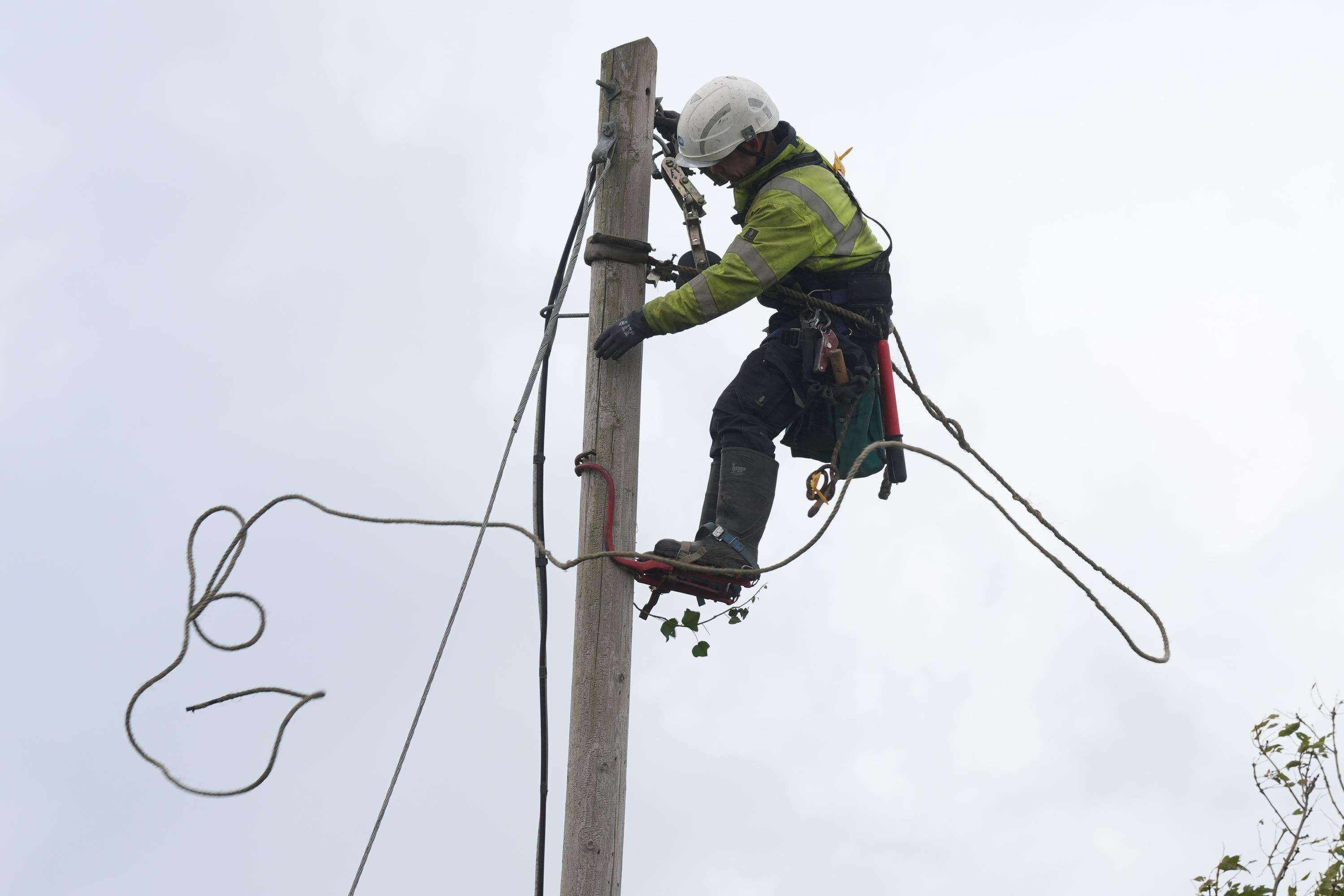 Electricity Supply Board (ESB) network technician Mark Lennon carries out repairs to fallen power cables in Balbriggan (Brian Lawless/PA)