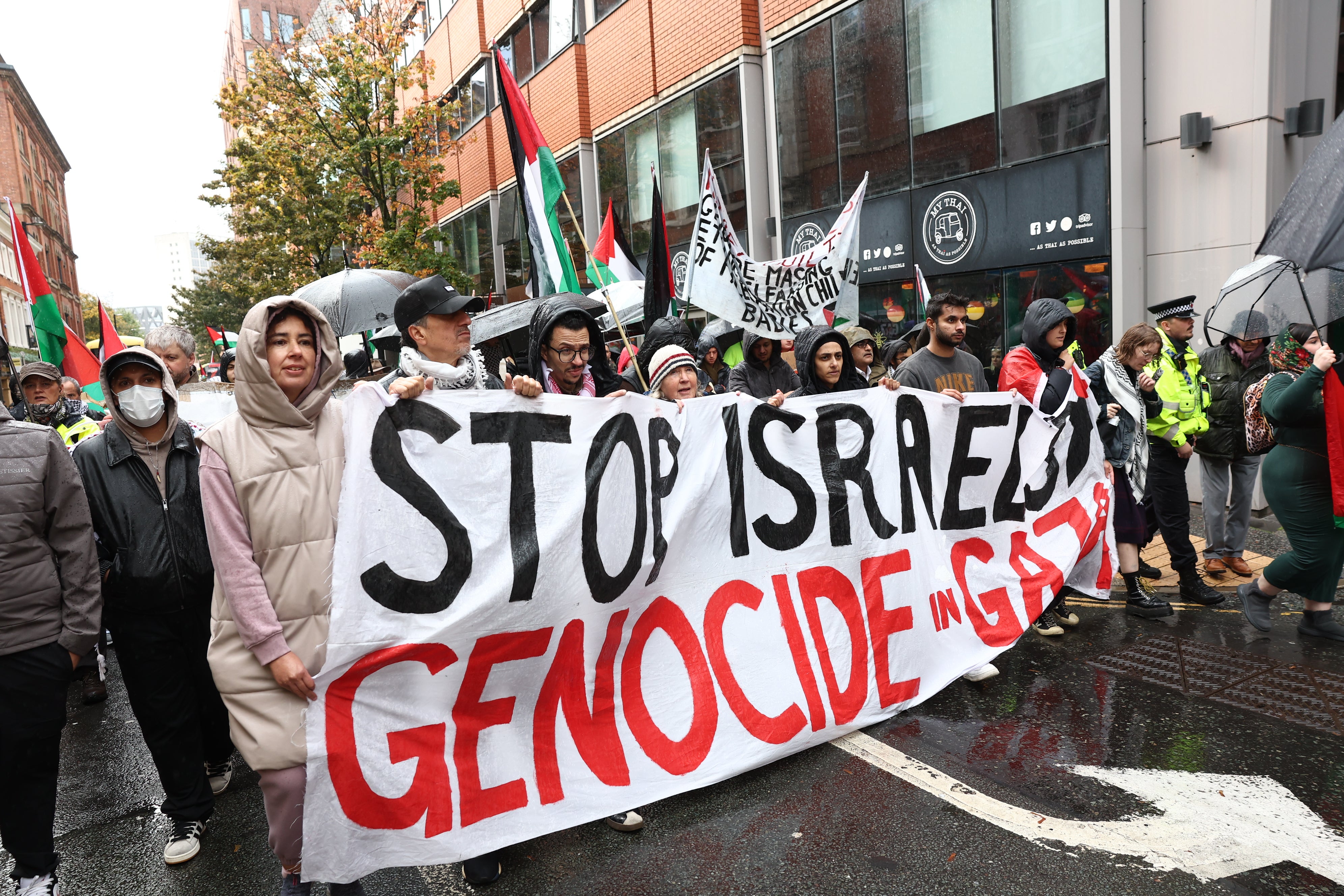 People take part in a demonstration organised by GM Friends of Palestine at Manchester Cathedral on Saturday
