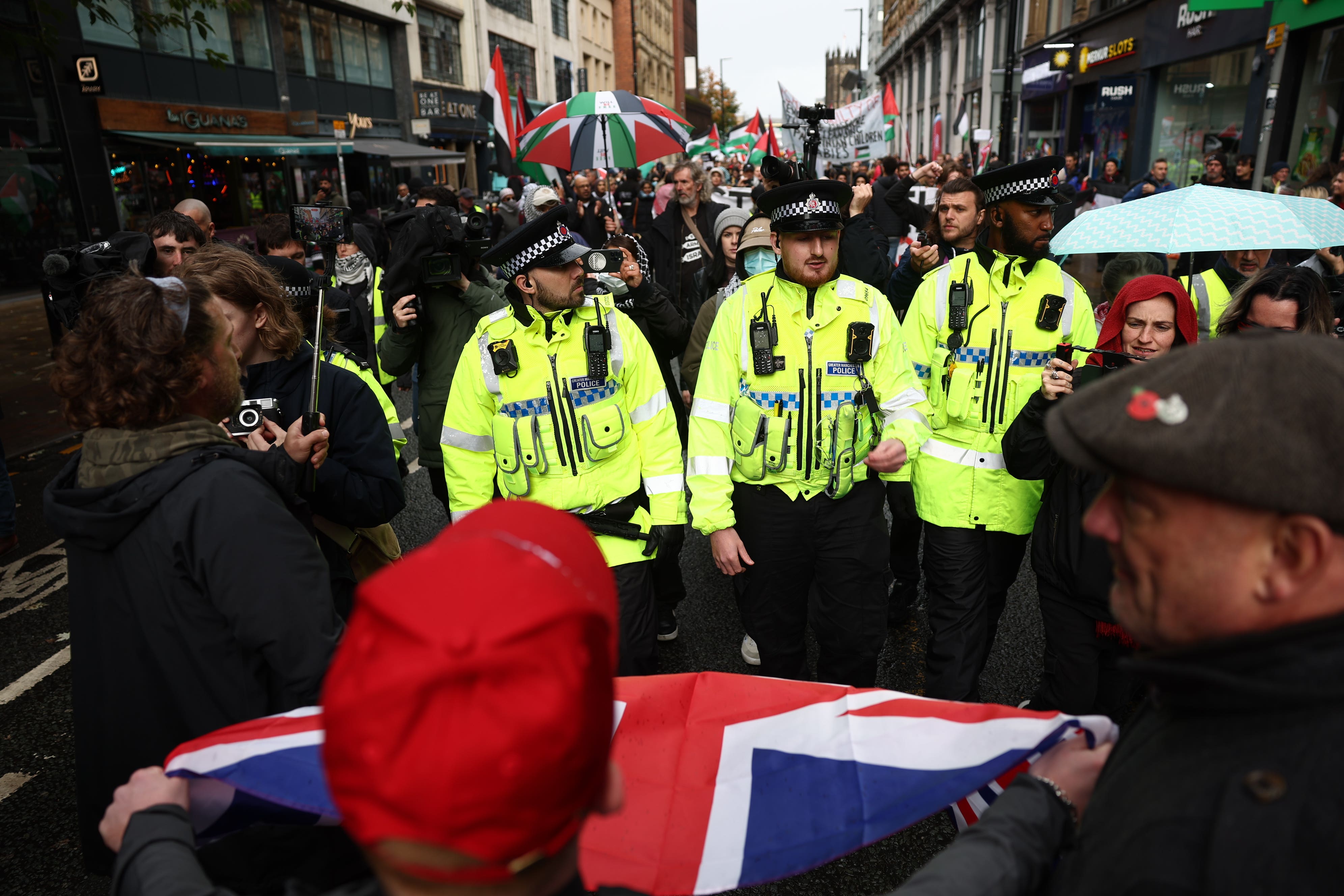 Counter protesters as people take part in a demonstration organised by GM Friends of Palestine at Manchester Cathedral (Ryan Jenkinson/PA)