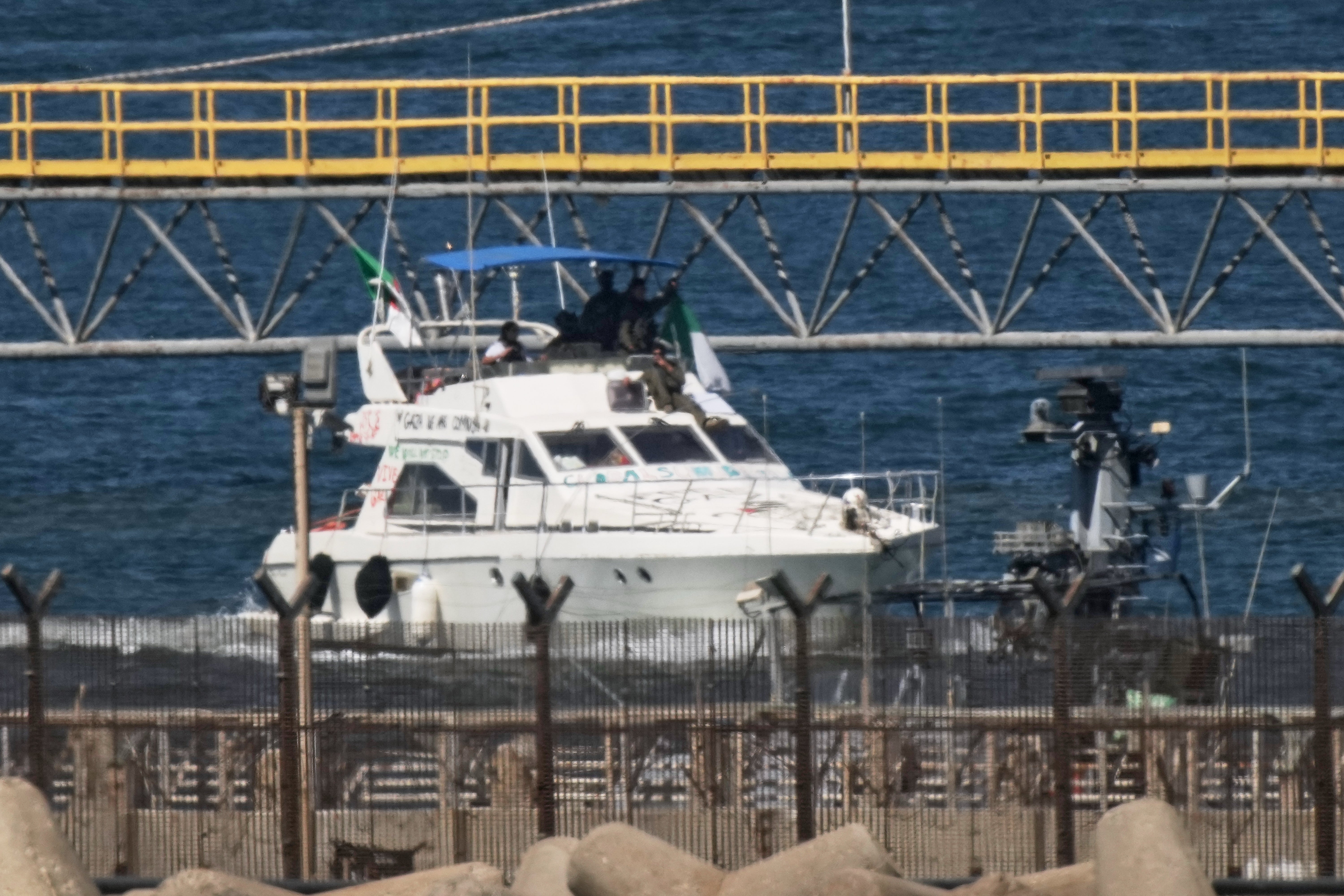 Israeli navy soldiers sail one of the Gaza-bound civilian flotilla Sumud's boats into the port of Ashdod, Israel