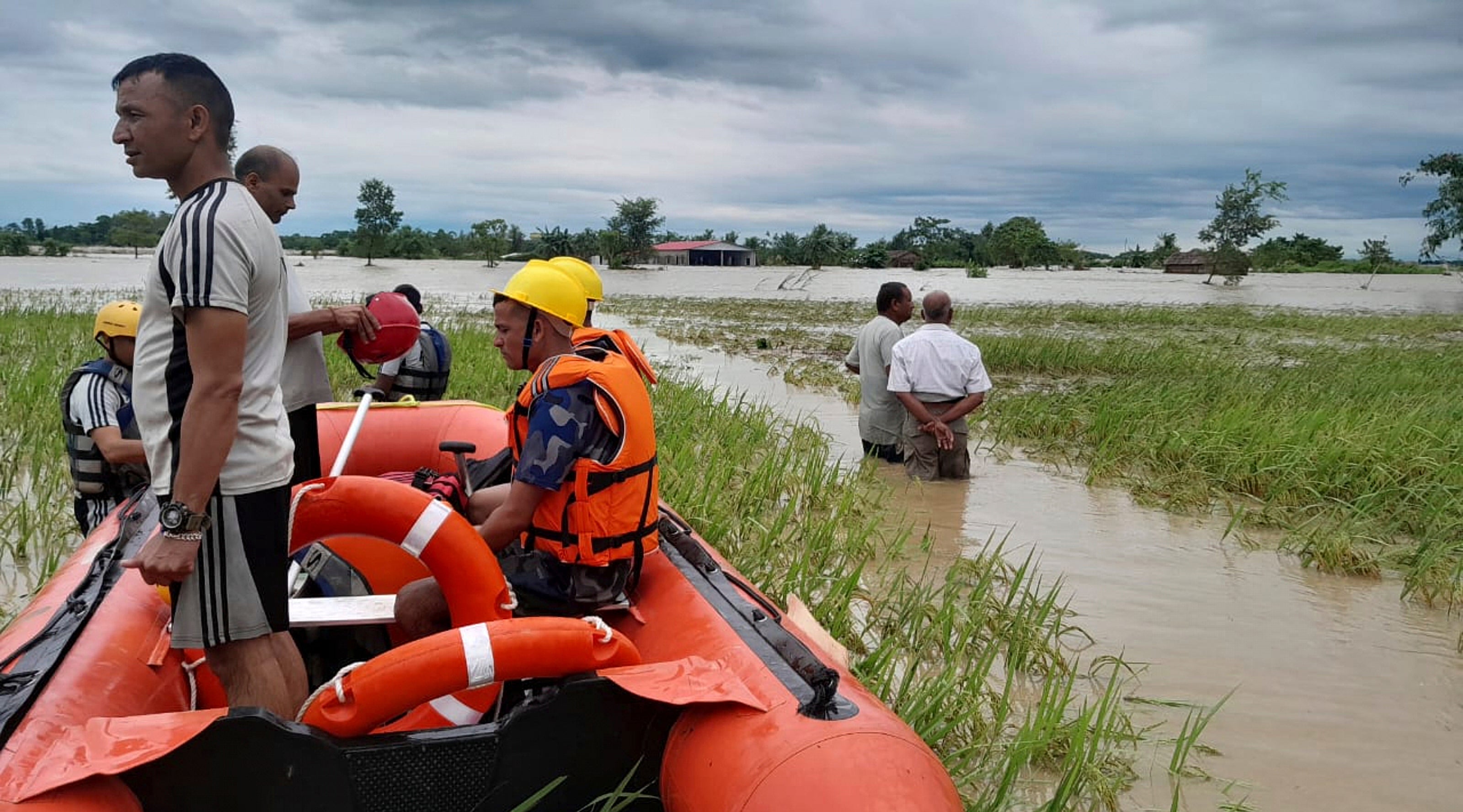 Nepalese army personnel get ready to rescue survivors after a flood in Jhapa district east of Nepal, Sunday