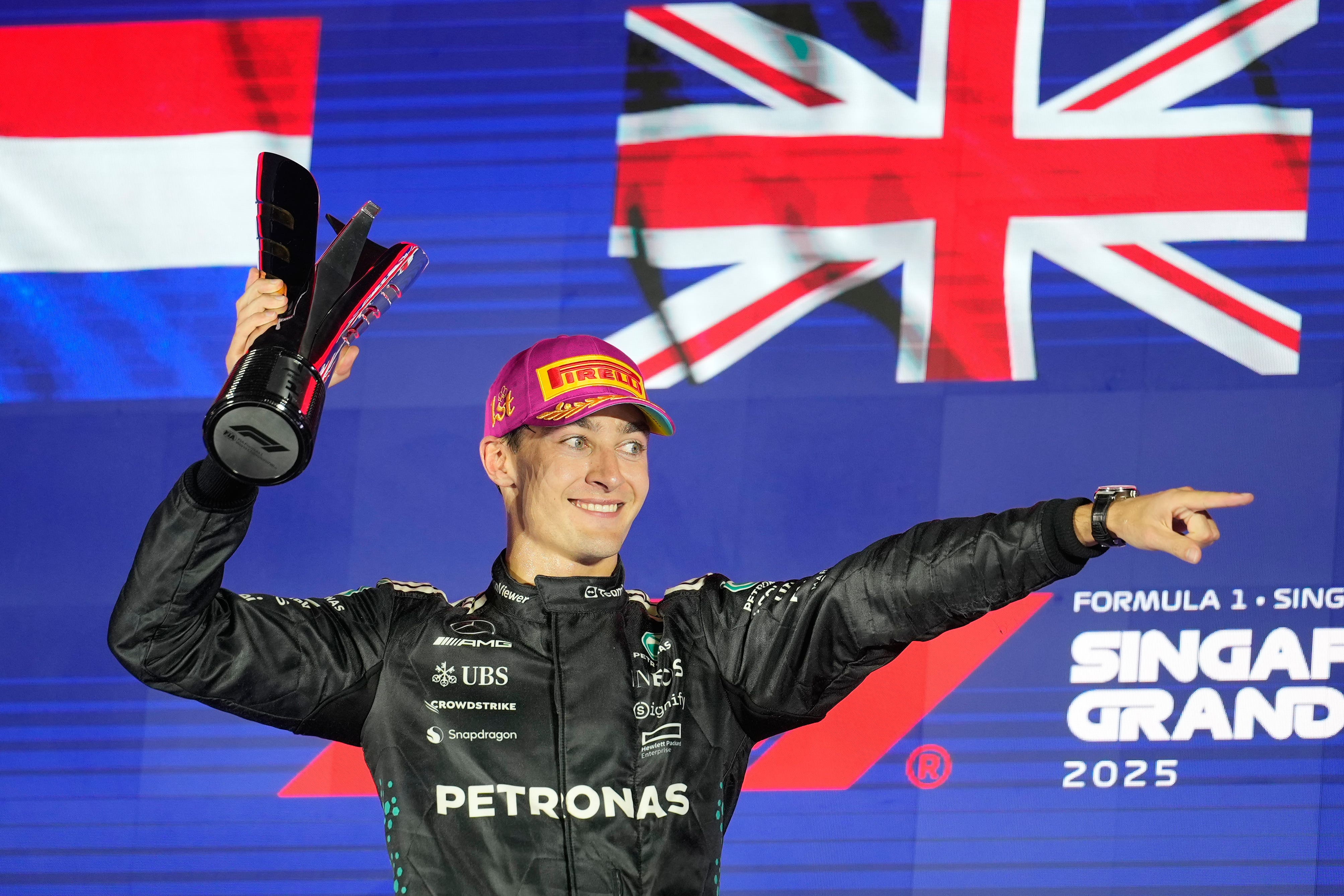 Mercedes driver George Russell celebrates winning the Singapore Grand Prix