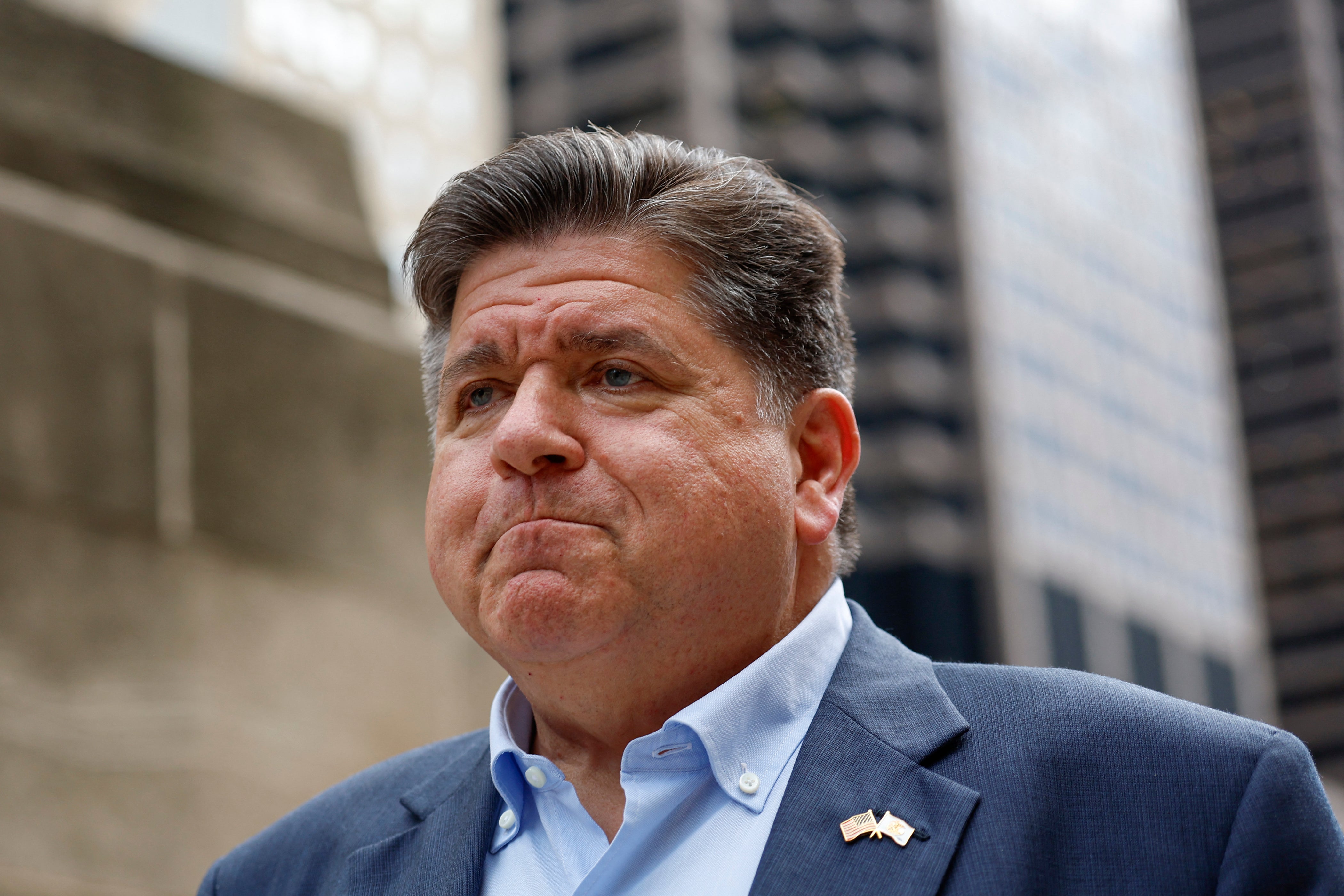 Governor JB Pritzker said it was ‘shameful’ that federal law enforcement used aggressive military-style tactics to arrest 37 immigrants in an apartment building in the middle of the night