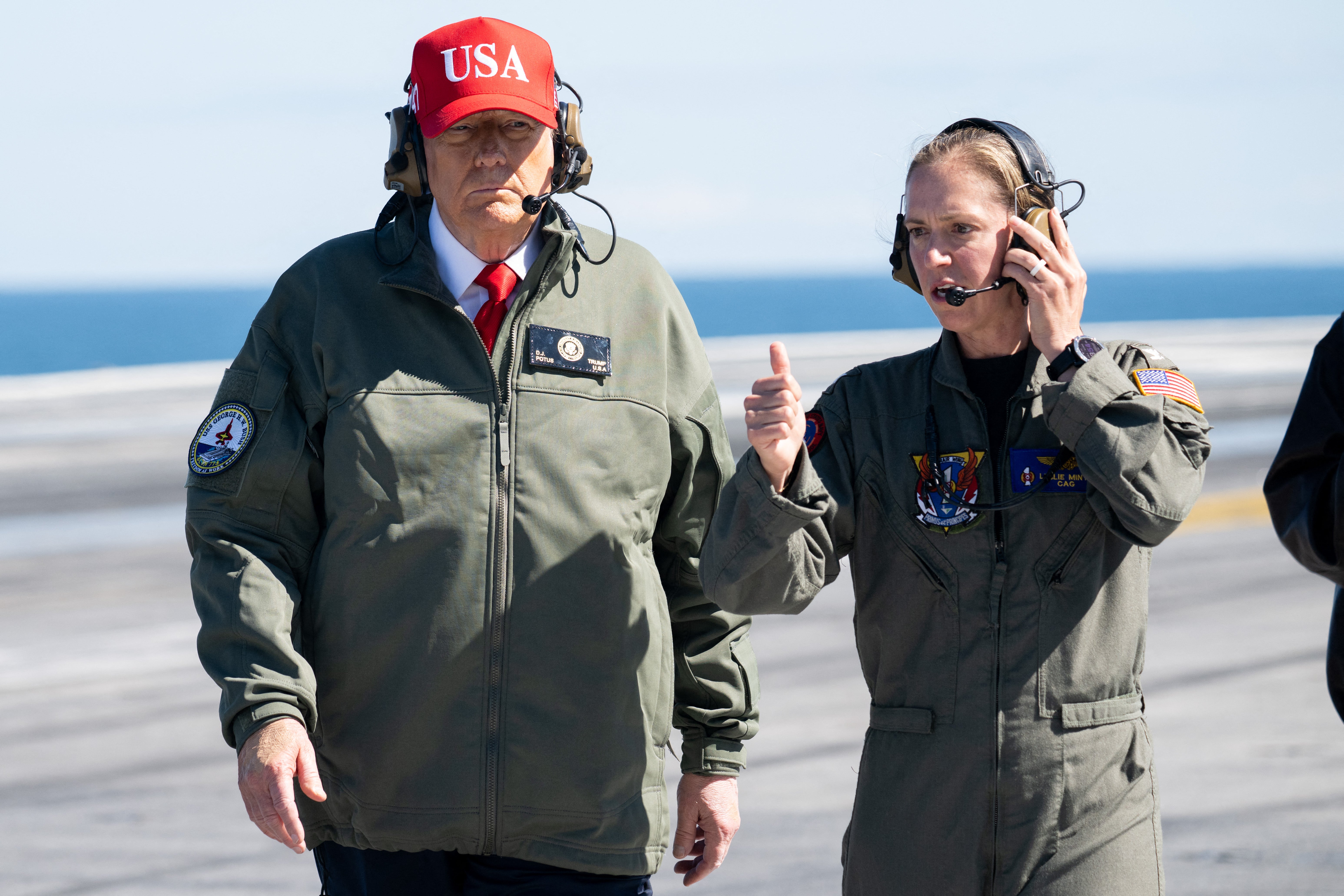 President Donald Trump visits the USS George H.W. Bush aircraft carrier which is out at sea near Norfolk, Virginia, October 5, 2025, as he travels to see a Naval demonstration as part of the US Navy's 250th anniversary celebration