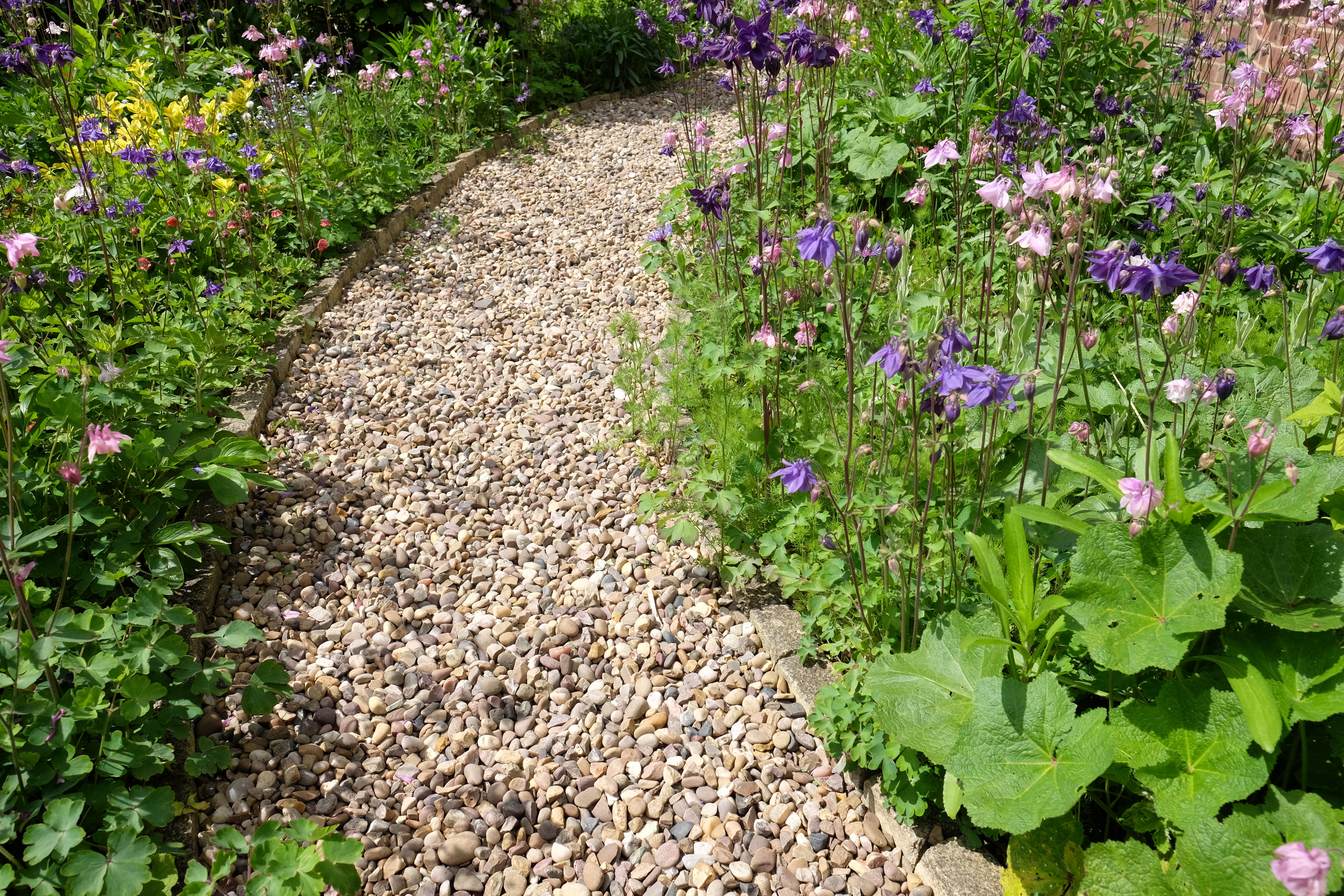 Gravel path in a garden (Alamy/PA)