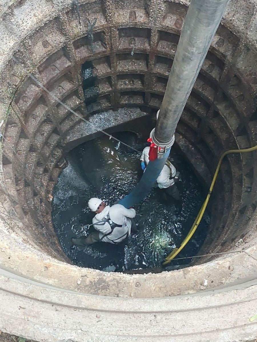 Thames Water worker working hard to remove the fatberg blockage