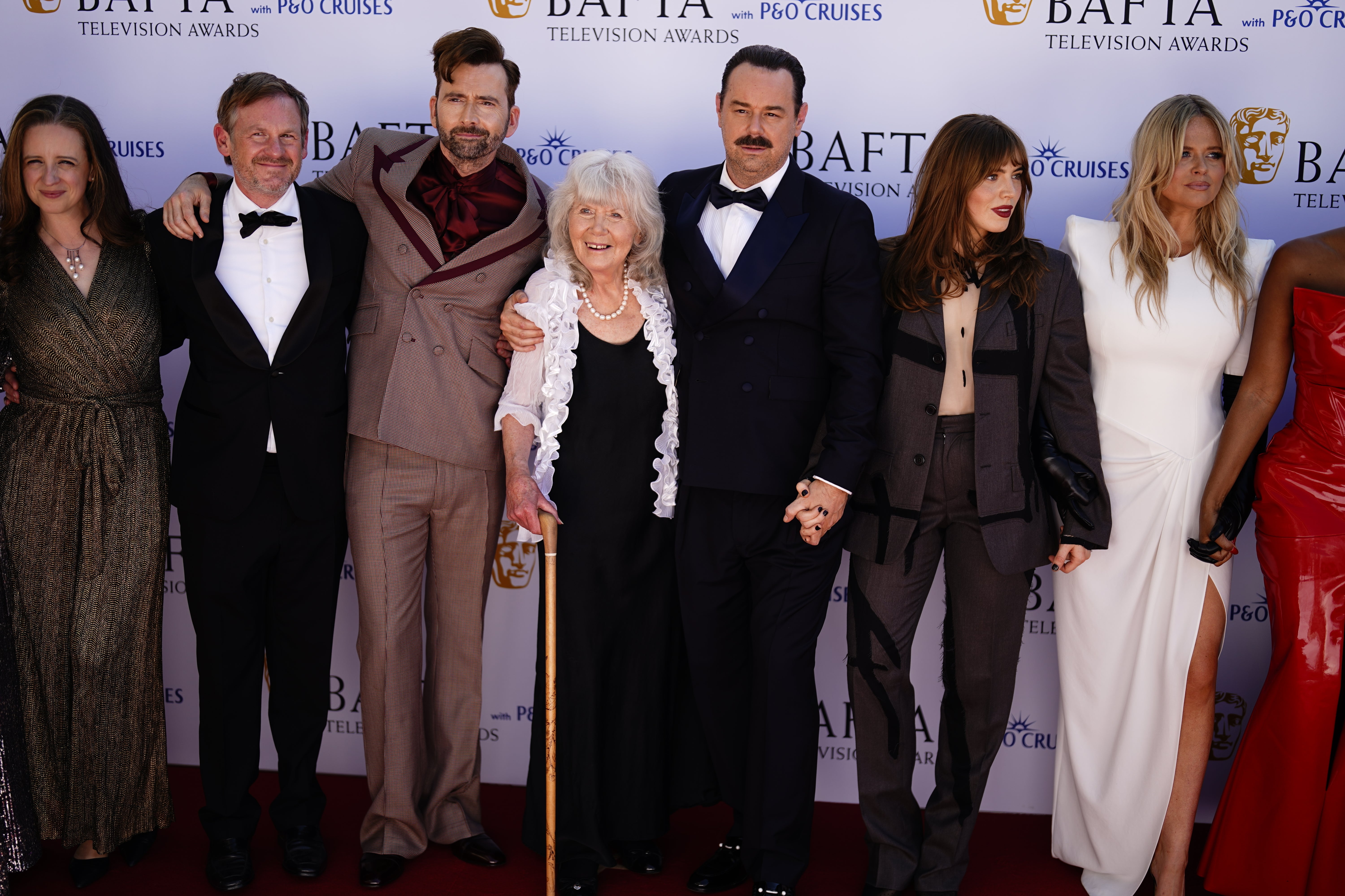 The cast of ‘Rivals’ with Cooper attending the 2025 Bafta Television Awards in May