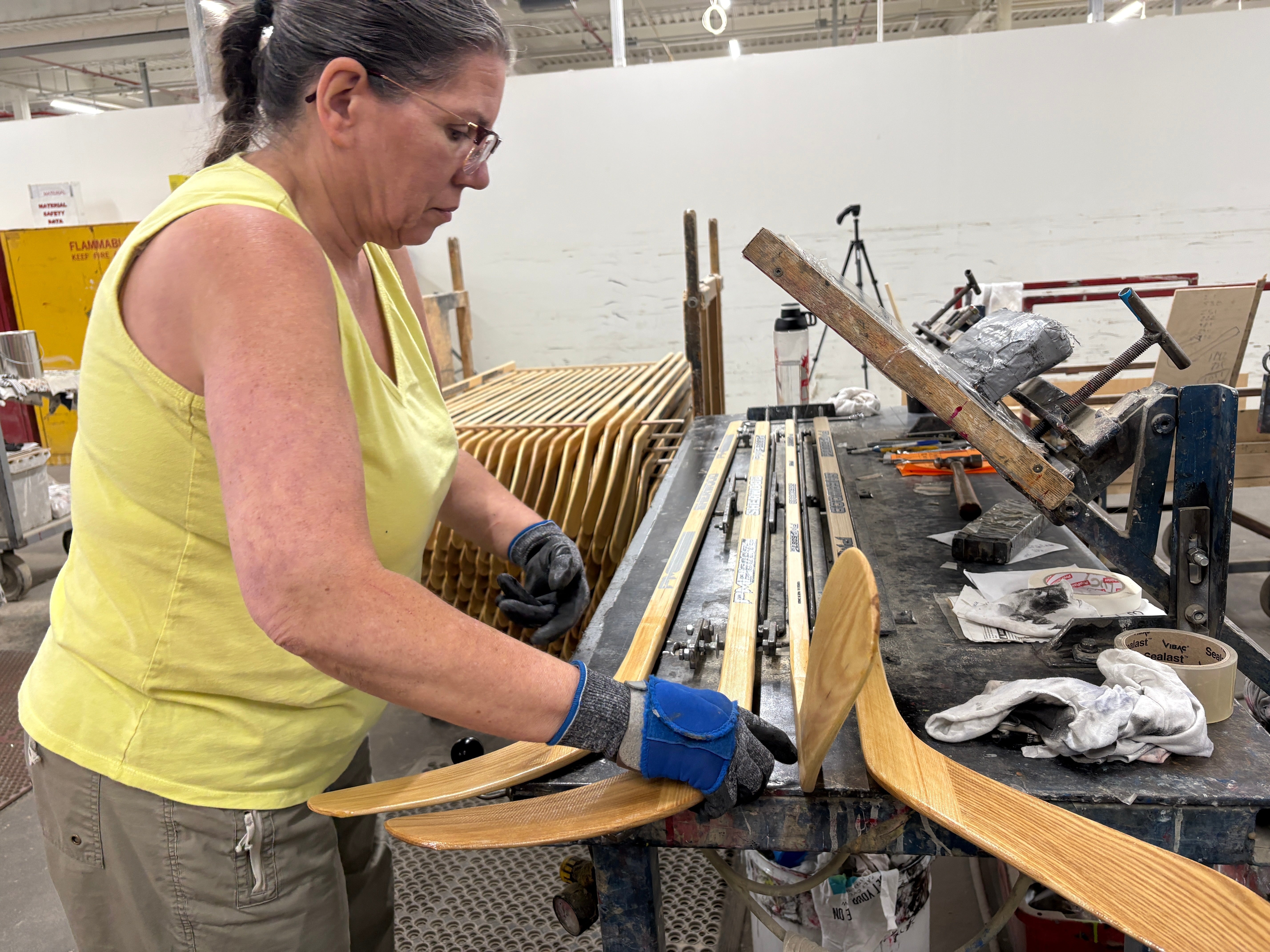 A worker makes wooden hockey sticks at the Roustan Hockey factory – the last major manufacturer of hockey sticks in Canada