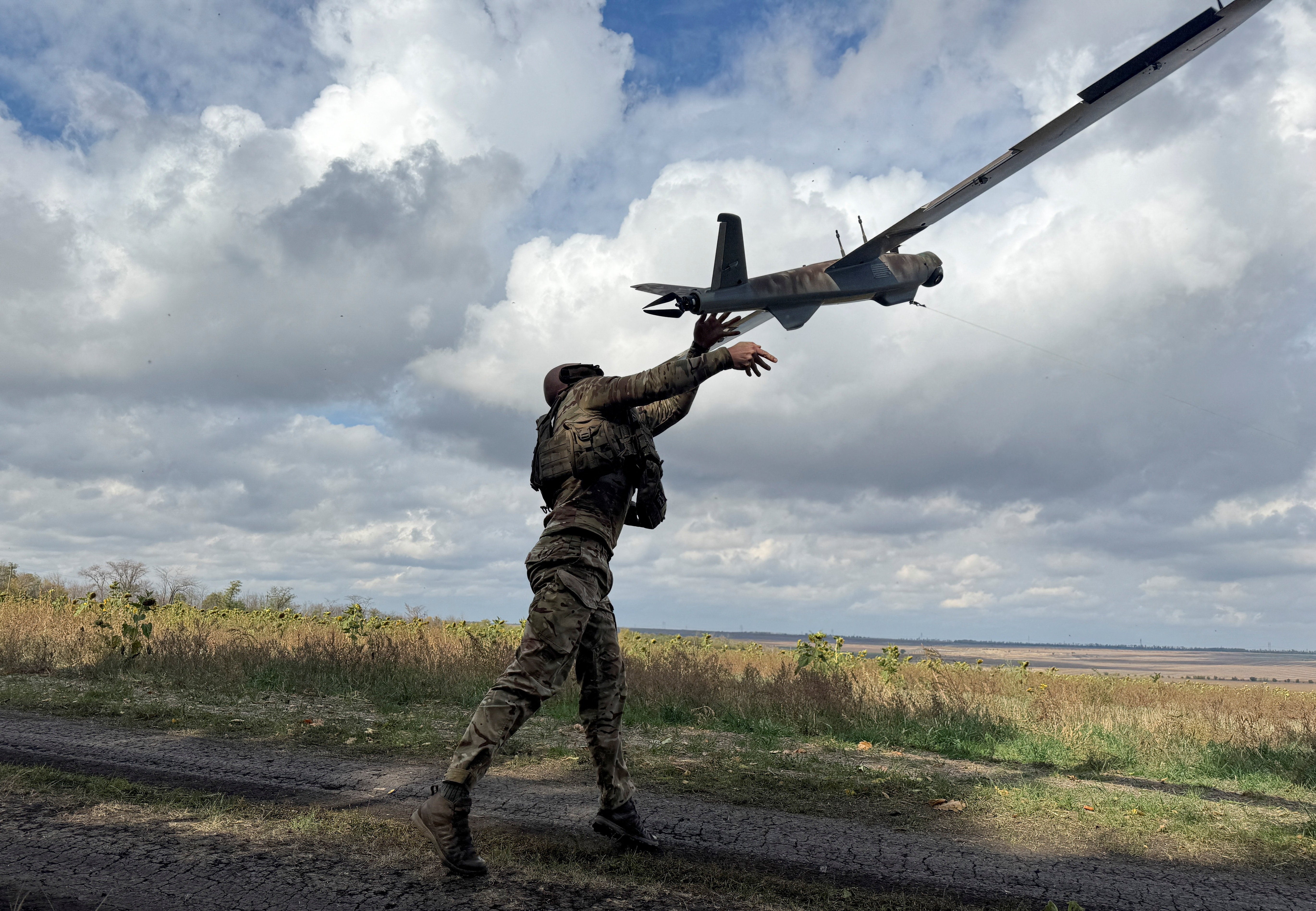 A serviceman of the 59th Separate Assault Brigade launches a reconnaissance drone, near the frontline town of Pokrovsk in Donetsk region, 6 October 2025