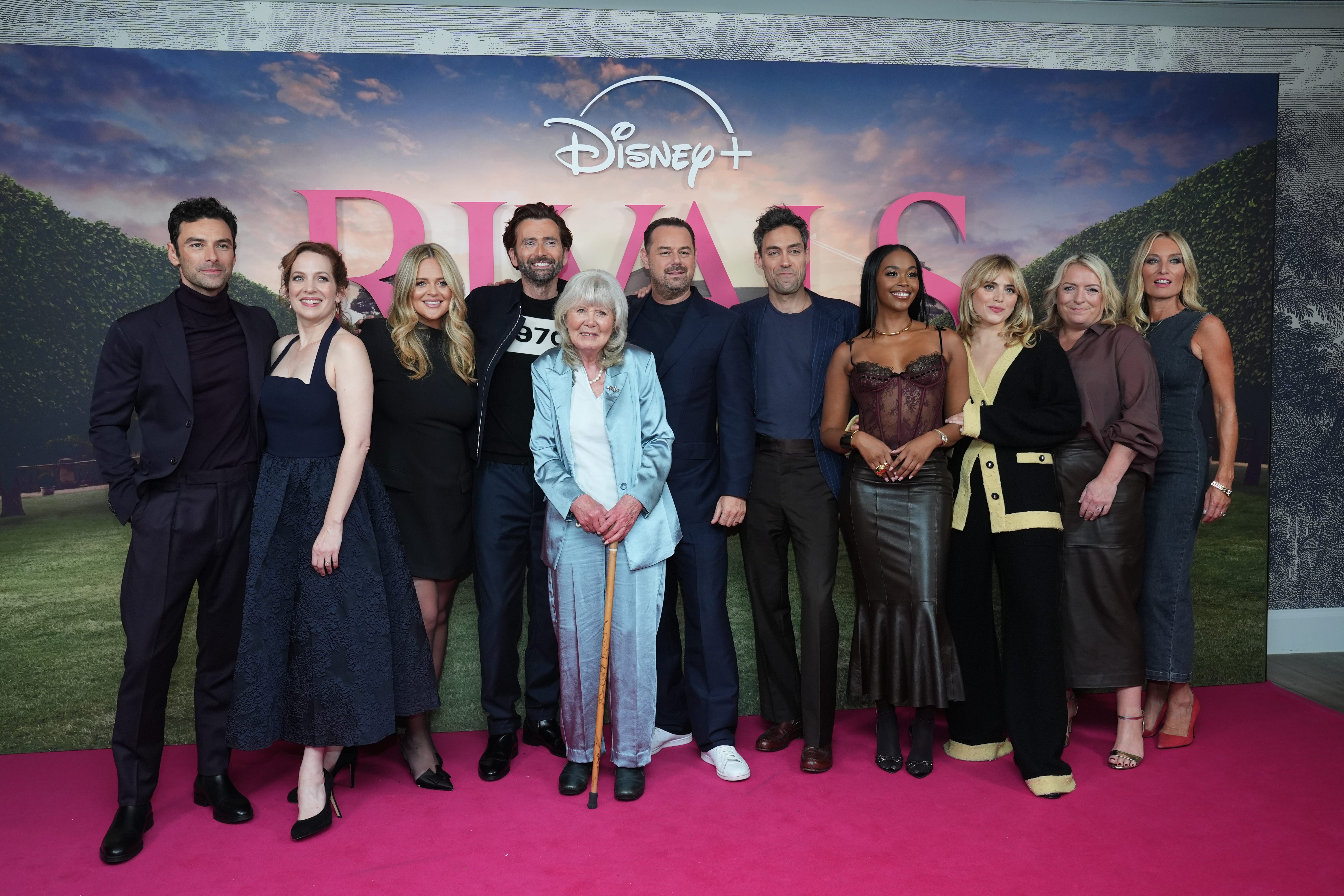 From left, ‘Rivals’ cast Aidan Turner, Katherine Parkinson, Emily Atack, David Tennant, Jilly Cooper, Danny Dyer, Alex Hassell, Nafessa Williams, Bella Maclean, Claire Rushbrook and Victoria Smurfit attending the UK special screening of the first series