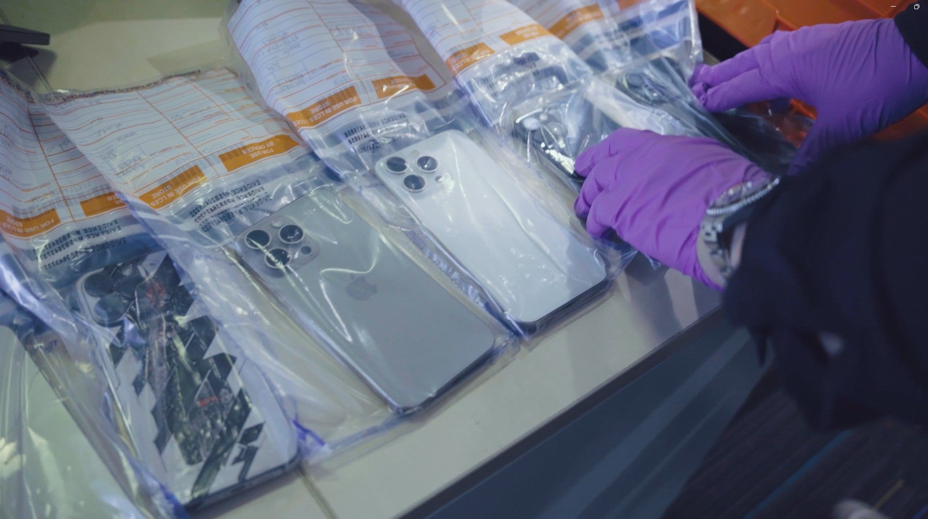 Police have disrupted an international network suspected of smuggling tens of thousands of stolen phones from the UK