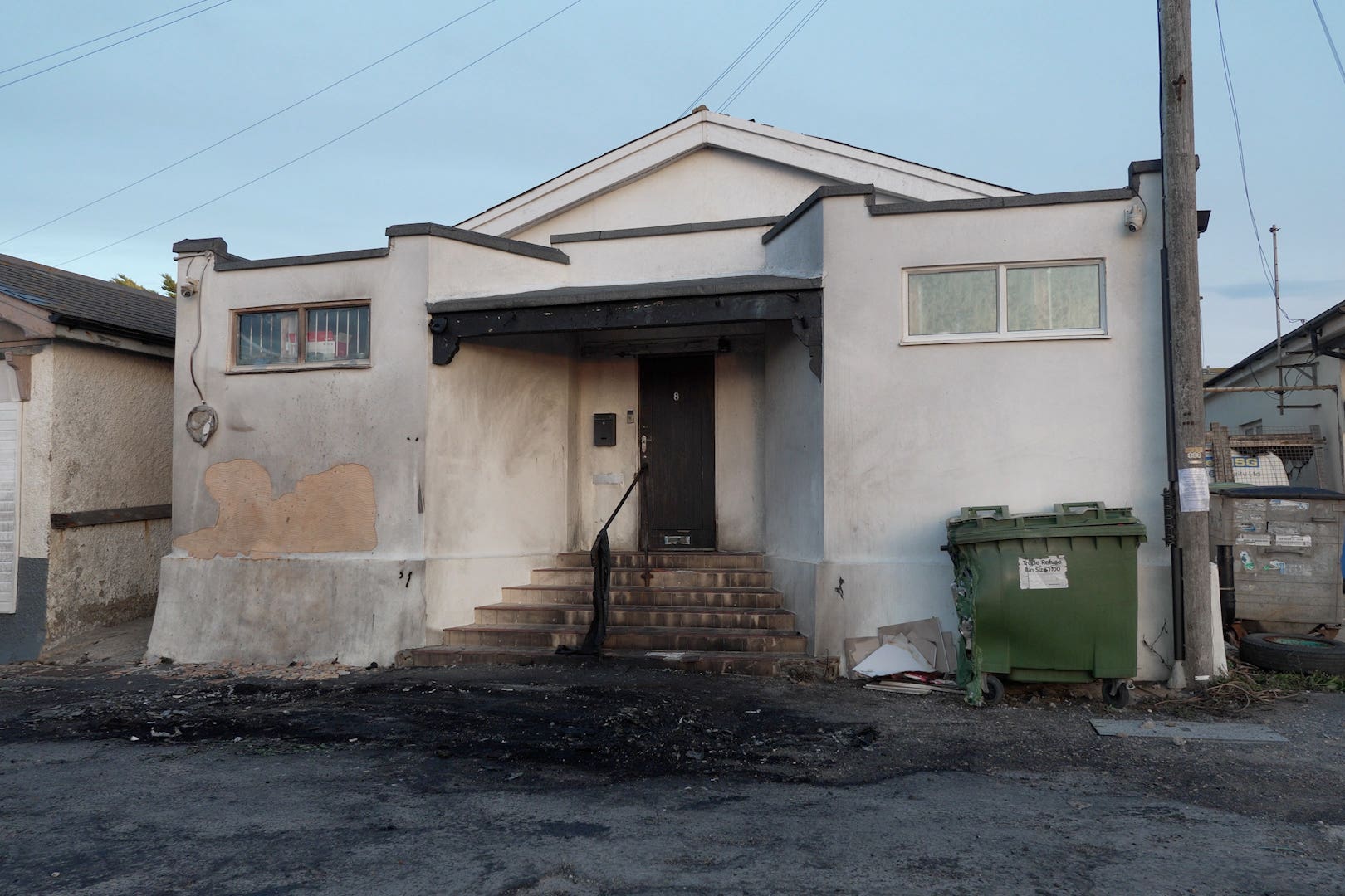 Damage outside the front entrance of the mosque in Phyllis Avenue, Peacehaven, East Sussex, following a suspected arson attack (Jamie Lashmar/PA)