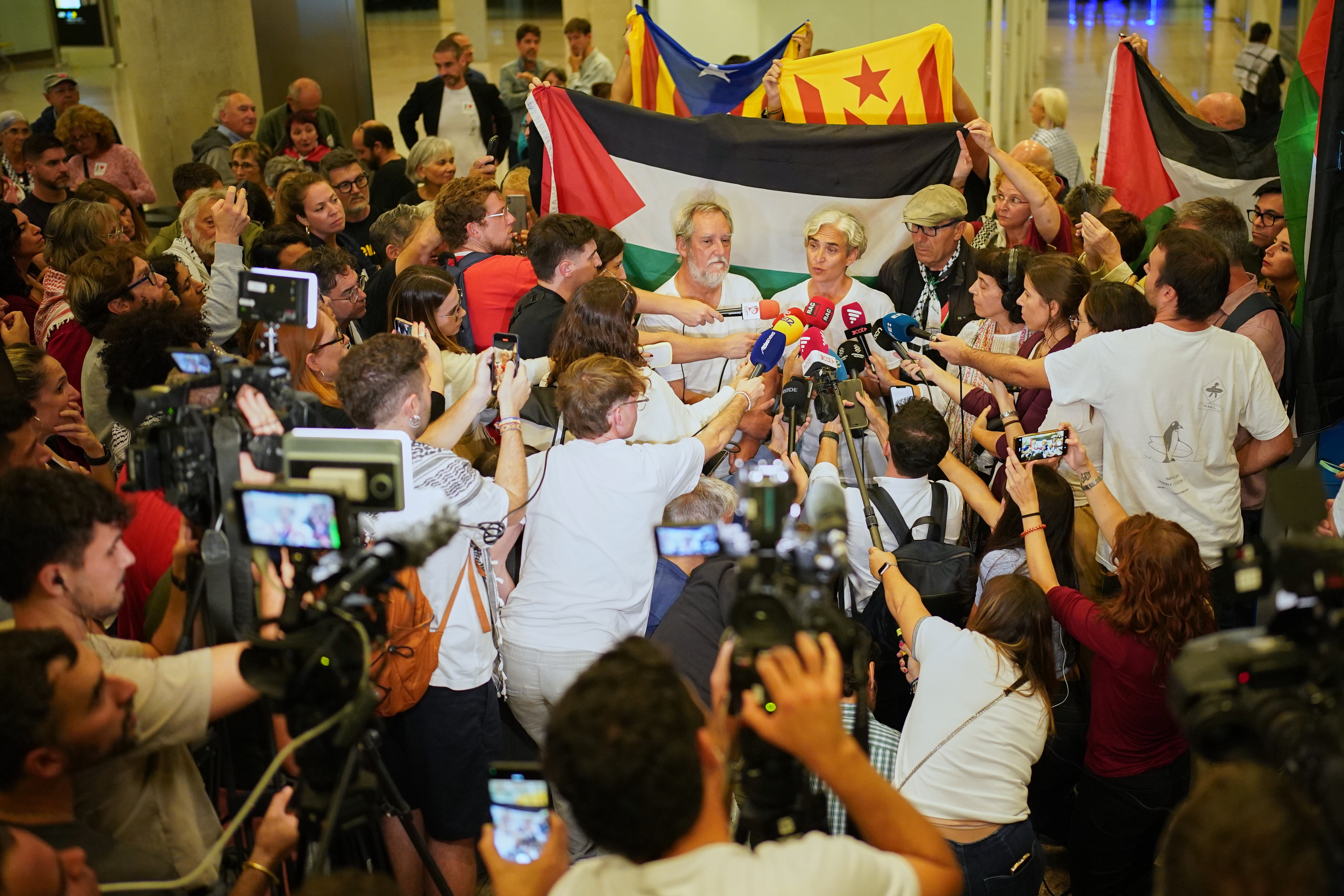 Former Barcelona mayor Ada Colau speaks with media as she arrives at the airport in Barcelona, Spain, Sunday, Oct. 5, 2025, after being arrested on the Global Sumud Flotilla and subsequently released by the Israeli authorities