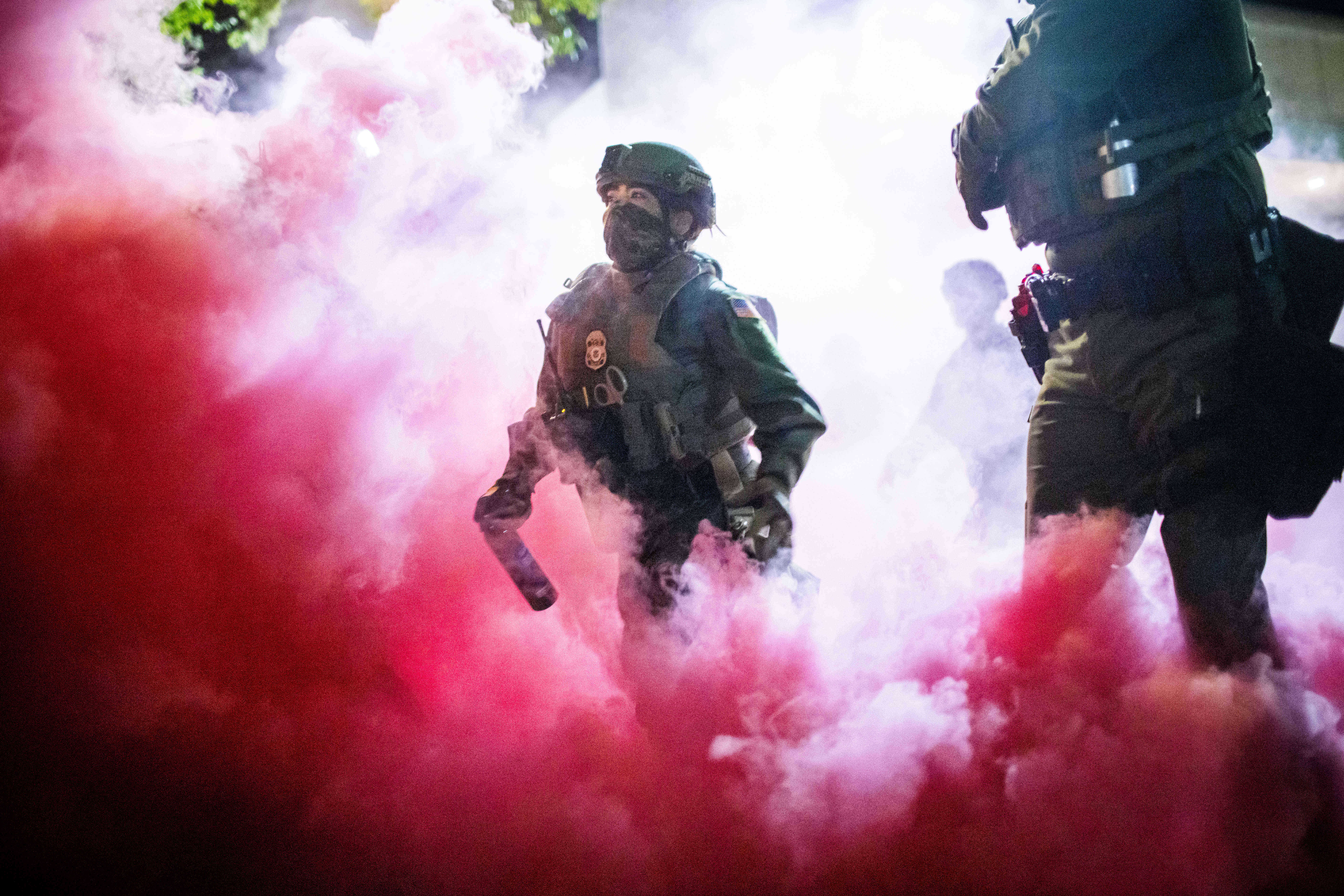 Law enforcement wading through tear gas in Portland