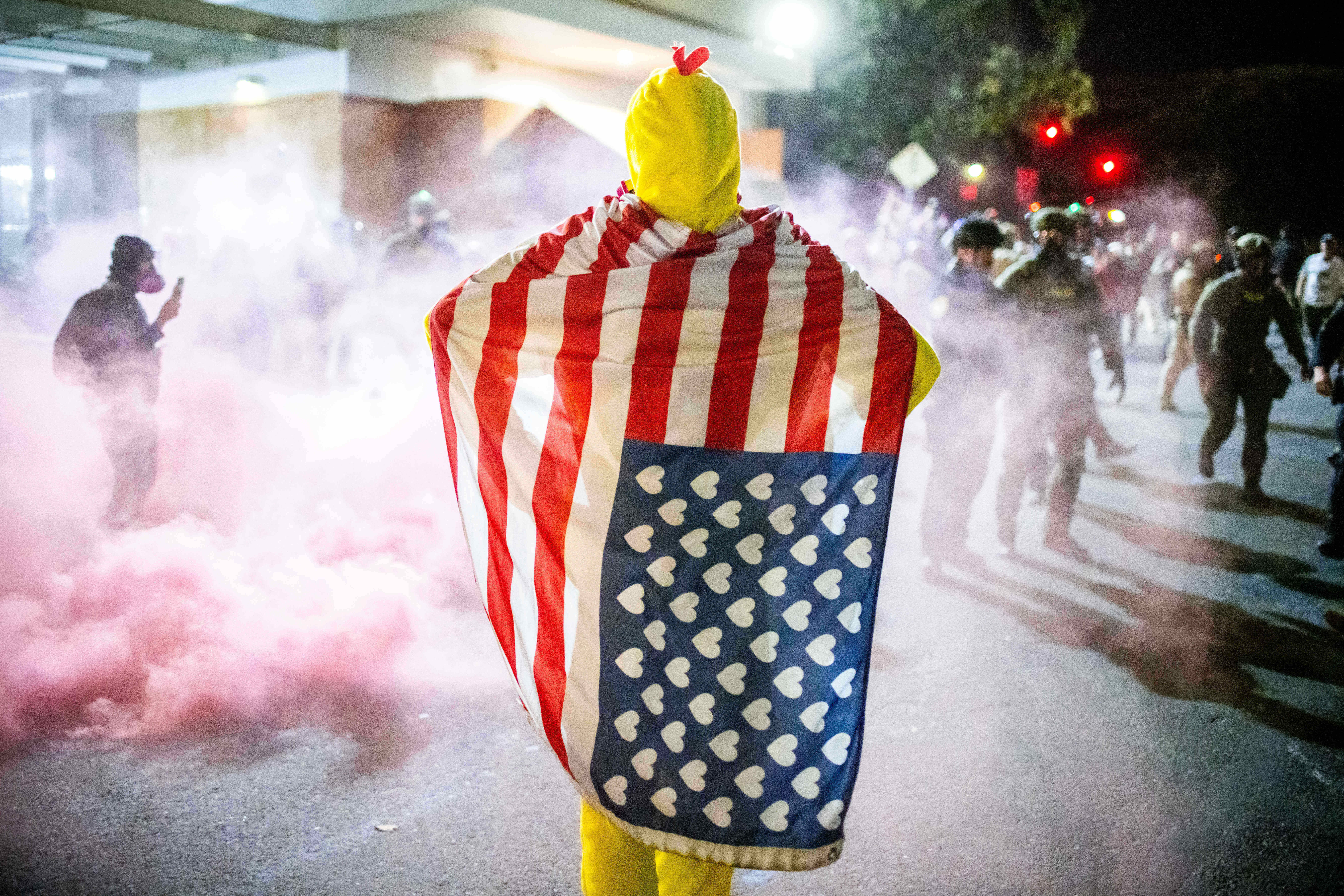 A costumed protester takes part in demonstrations against a proposed National Guard deployment to Portland, Oregon, Sunday