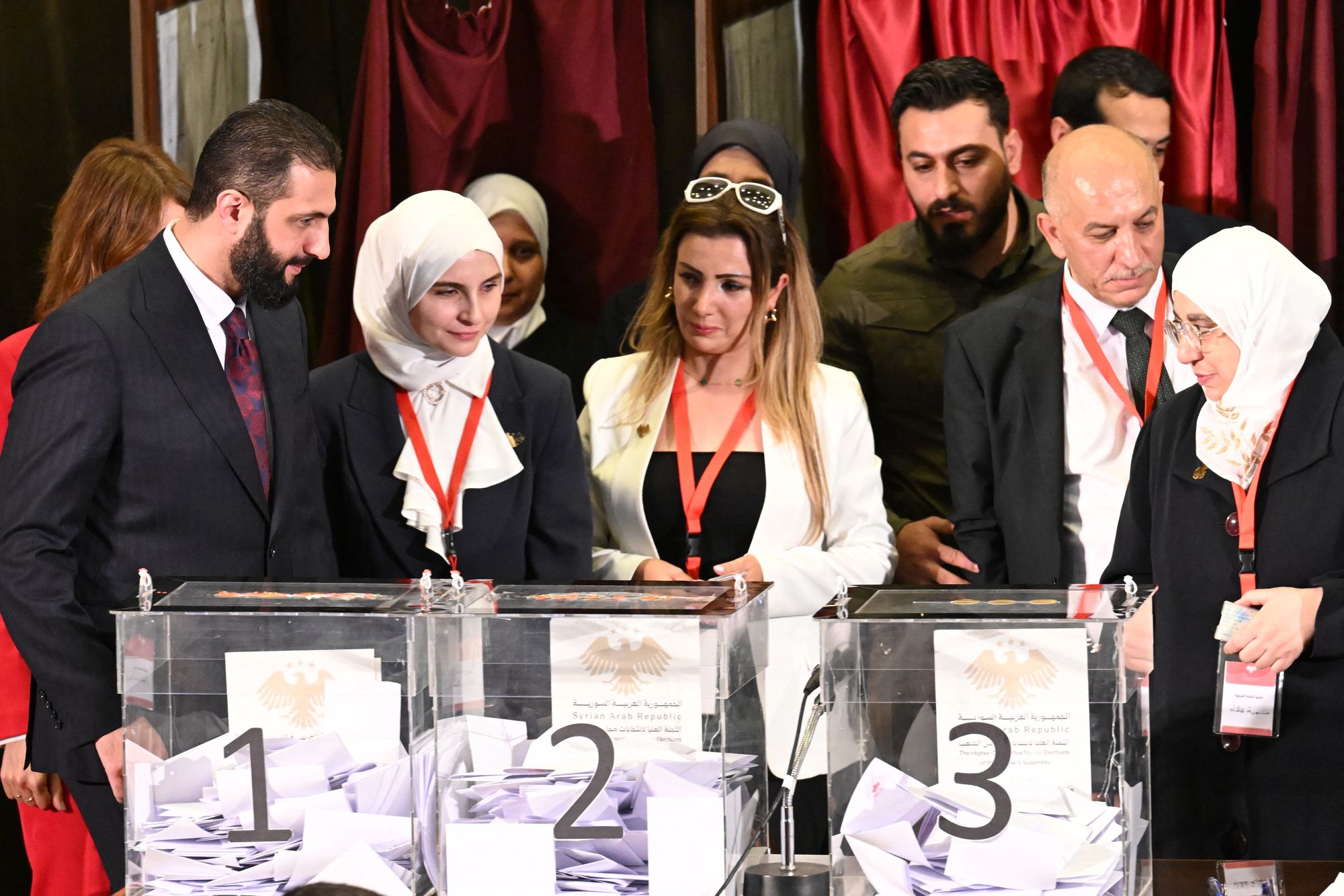 Sharaa stands by as members of Syrian local committees cast their votes
