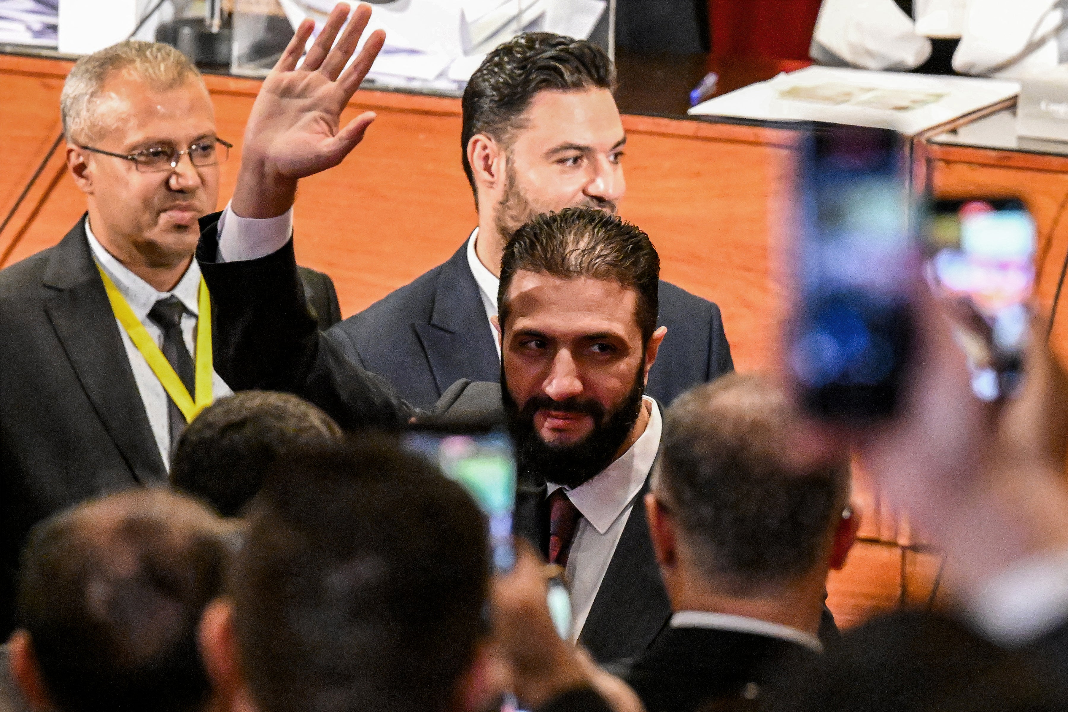 Syria’s interim President Ahmed al-Sharaa visits a polling station in Damascus, where members of Syrian local committees have been casting their votes