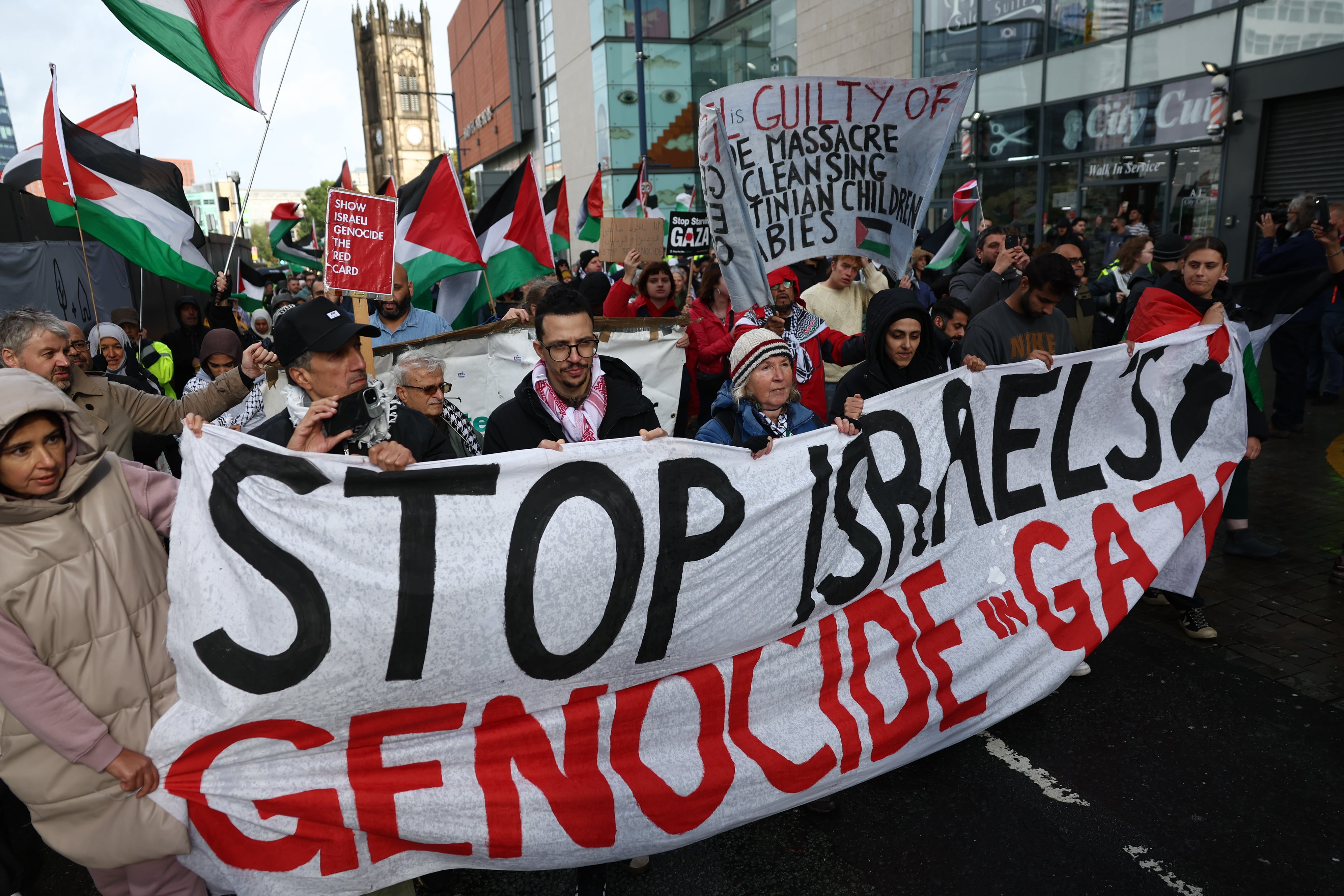 People take part in a demonstration organised by GM Friends of Palestine at Manchester Cathedral on Saturday